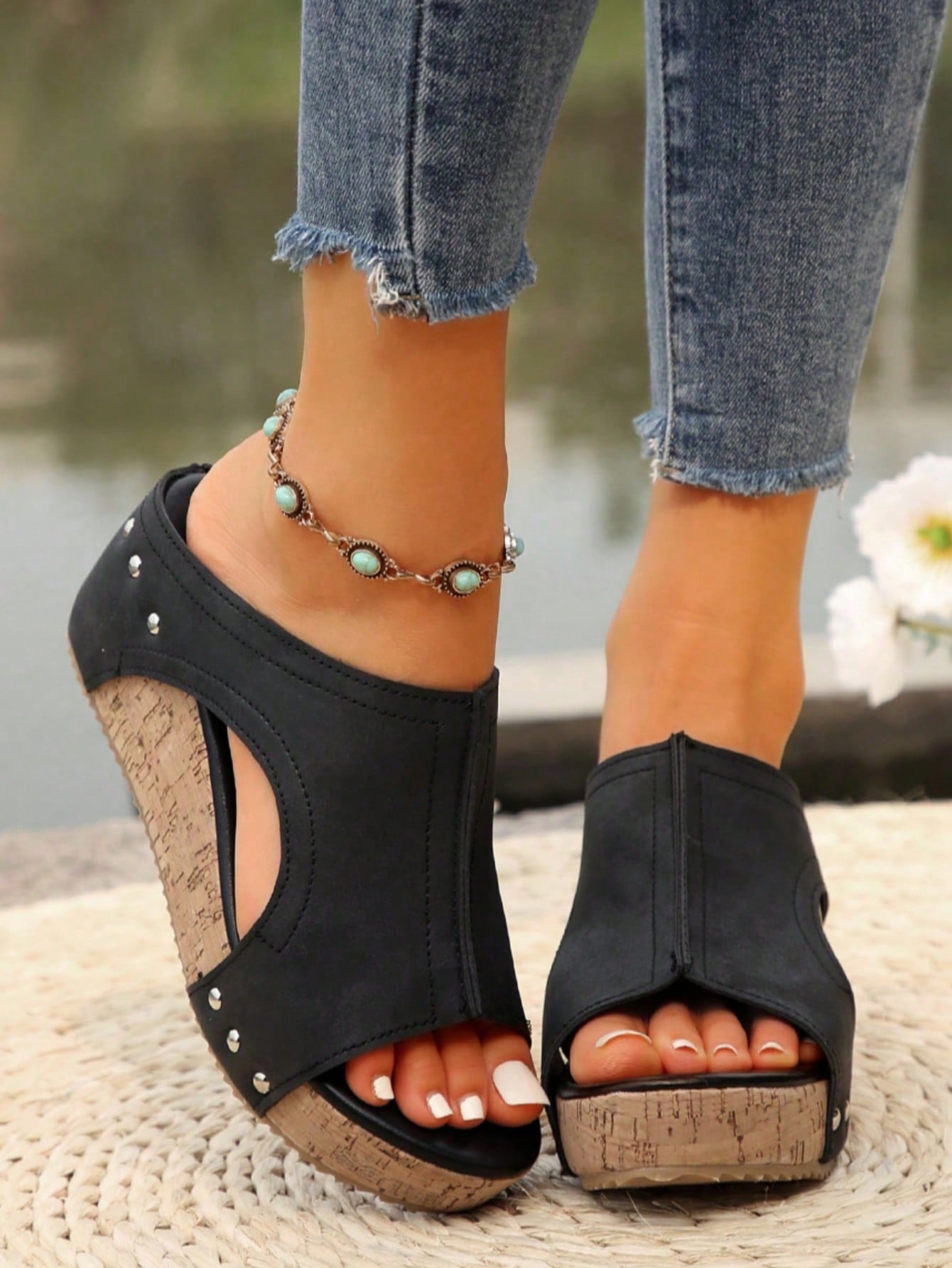 Women's plain slip-on slippers with a round toe, platform sole, and studded details, designed for casual daily wear and vacation outfits.