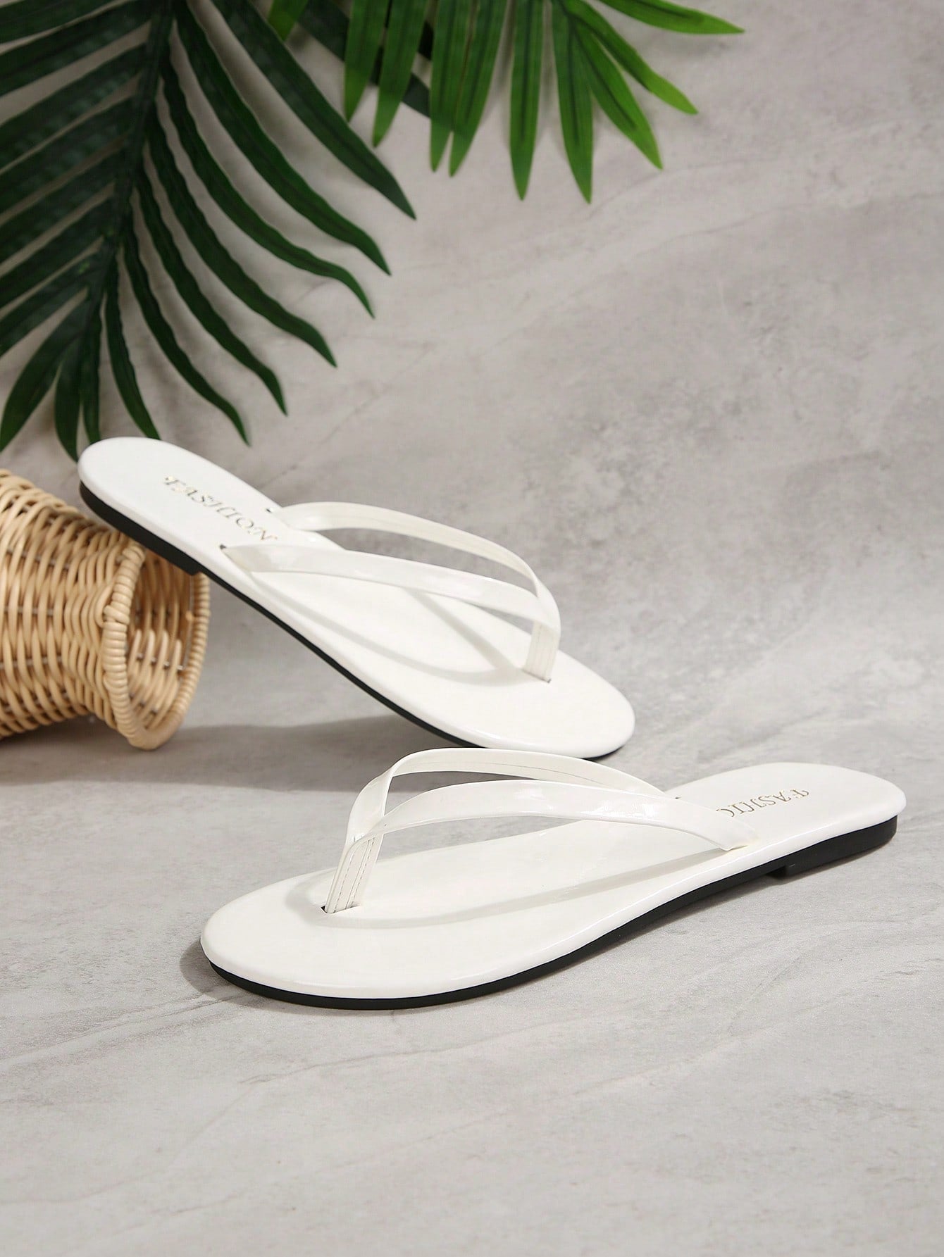 Women's chocolate brown flat flip flop sandals featuring a toe-post thong style and braided detail, suitable for casual indoor and outdoor wear.