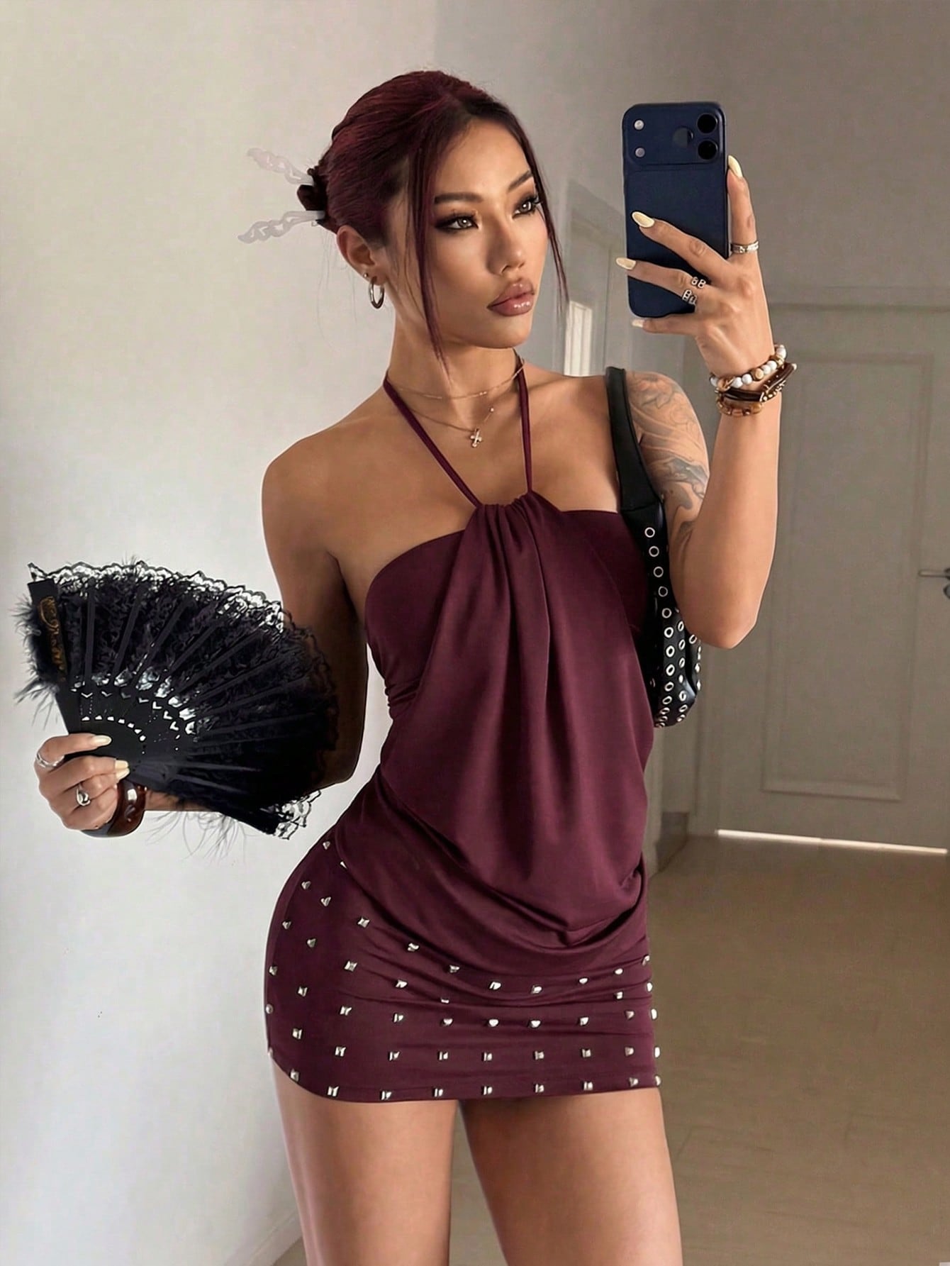 Women's brown beaded halter mini dress with a backless tie-back knot design, sleeveless slim fit silhouette, and pencil hem.