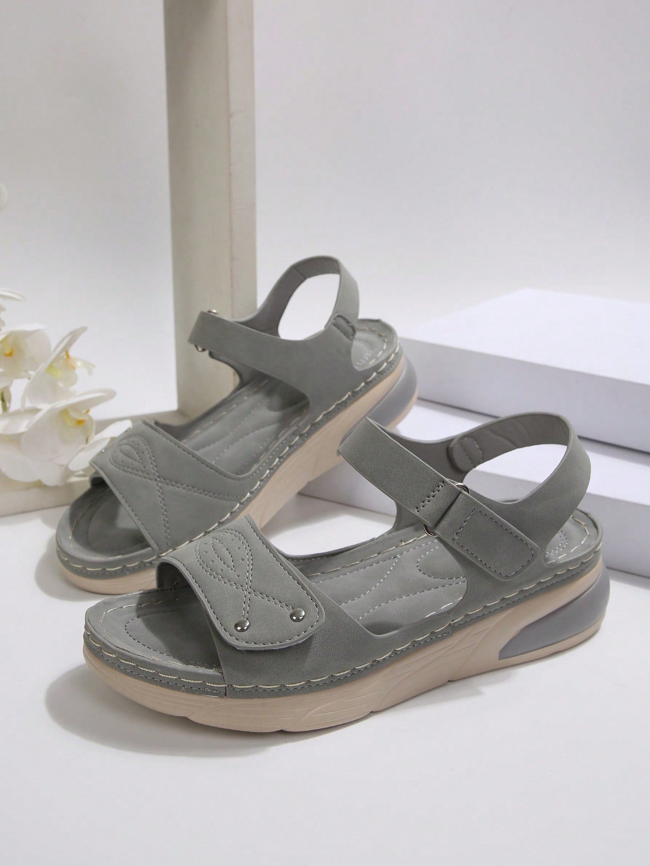 Women's plus size platform wedge sandals with hook-and-loop closure, open toe, ankle strap, and cut-out detailing in a casual beach style.