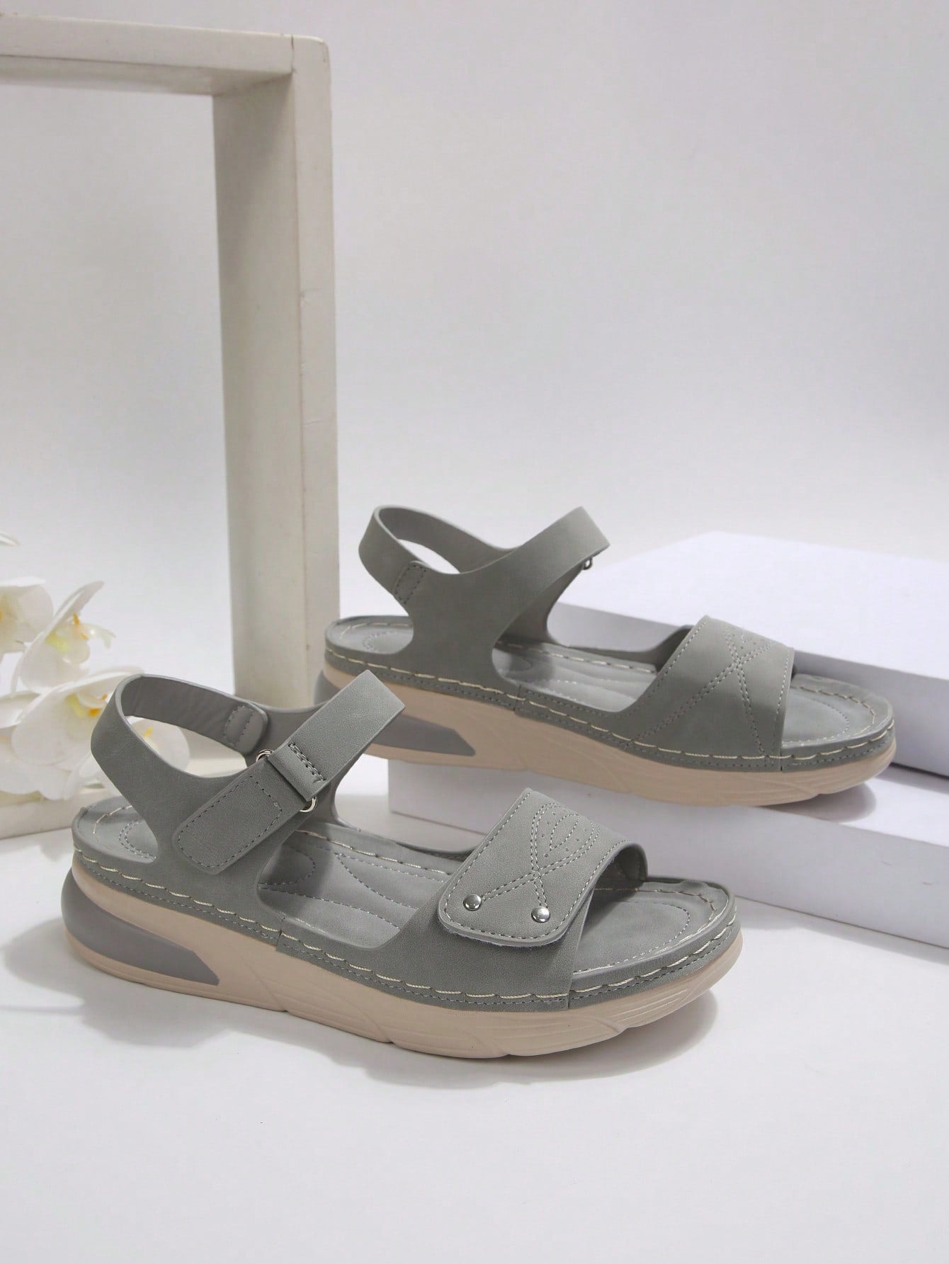 Women's plus size platform wedge sandals with hook-and-loop closure, open toe, ankle strap, and cut-out detailing in a casual beach style.
