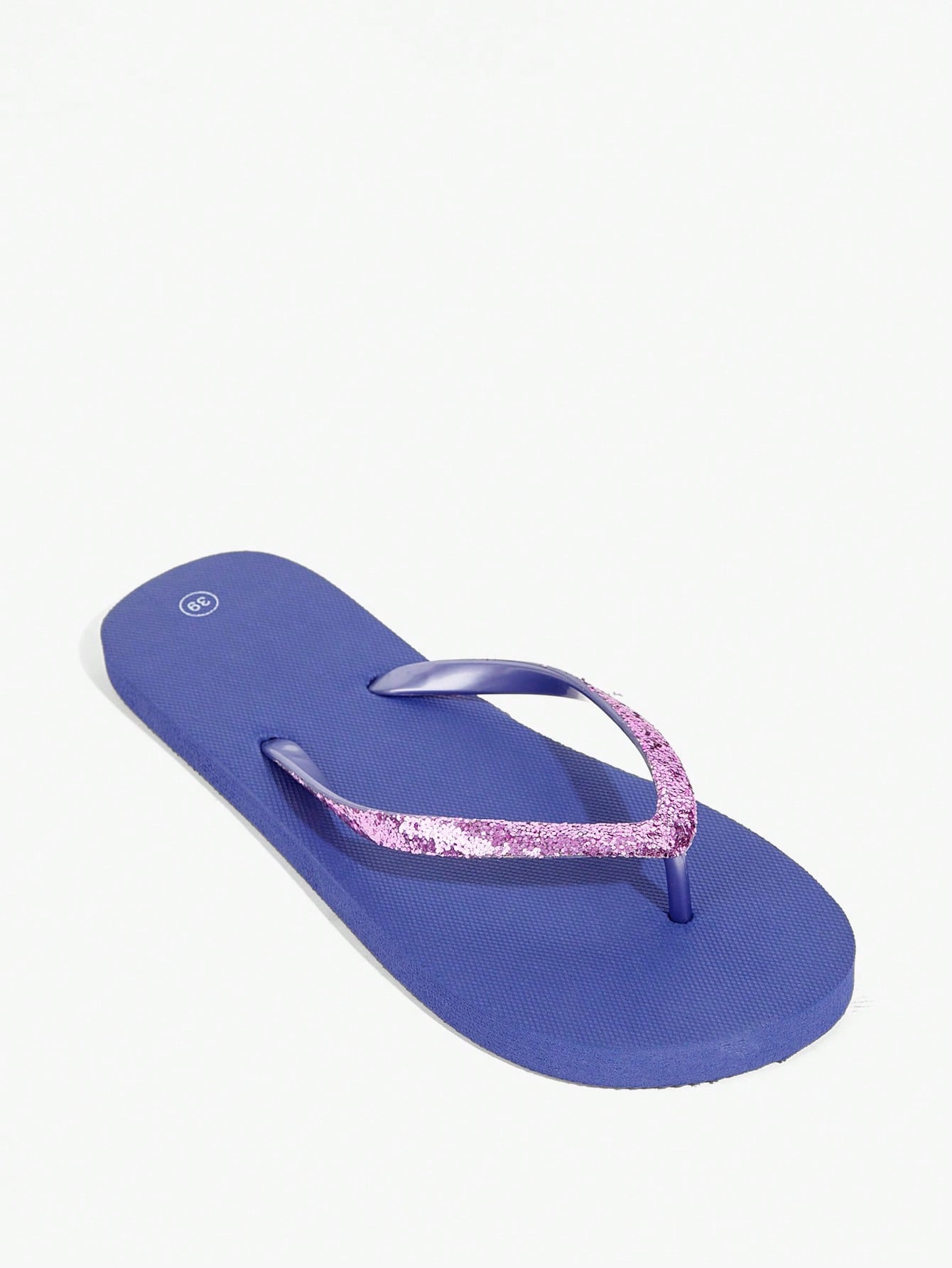 Pair of women’s apricot flat flip-flops with a glitter upper and plain design, suitable for beach, outdoor, home, and vacation wear.