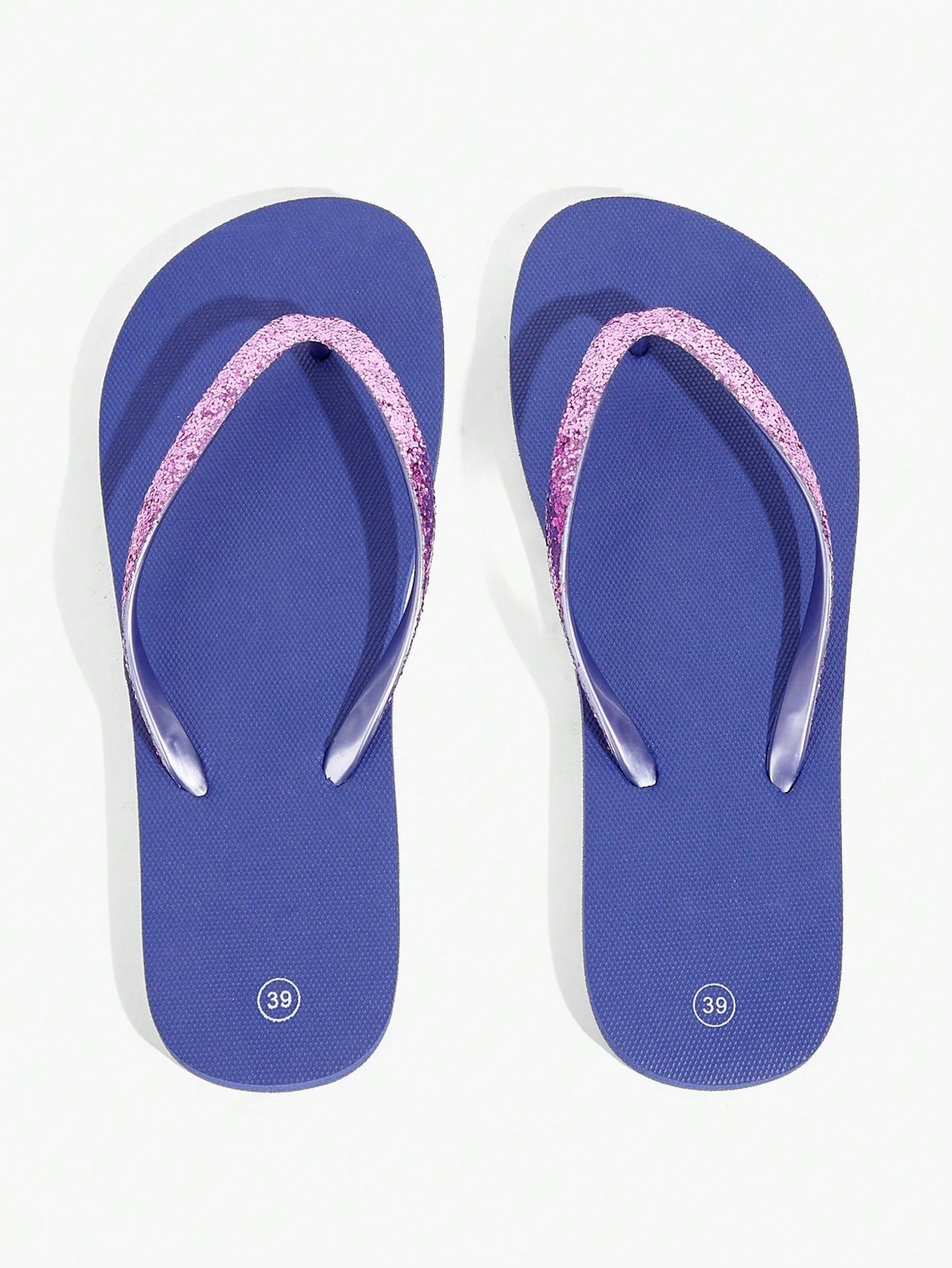 Pair of women’s apricot flat flip-flops with a glitter upper and plain design, suitable for beach, outdoor, home, and vacation wear.