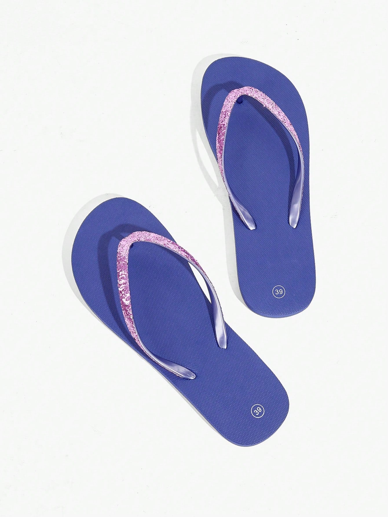 Pair of women’s apricot flat flip-flops with a glitter upper and plain design, suitable for beach, outdoor, home, and vacation wear.