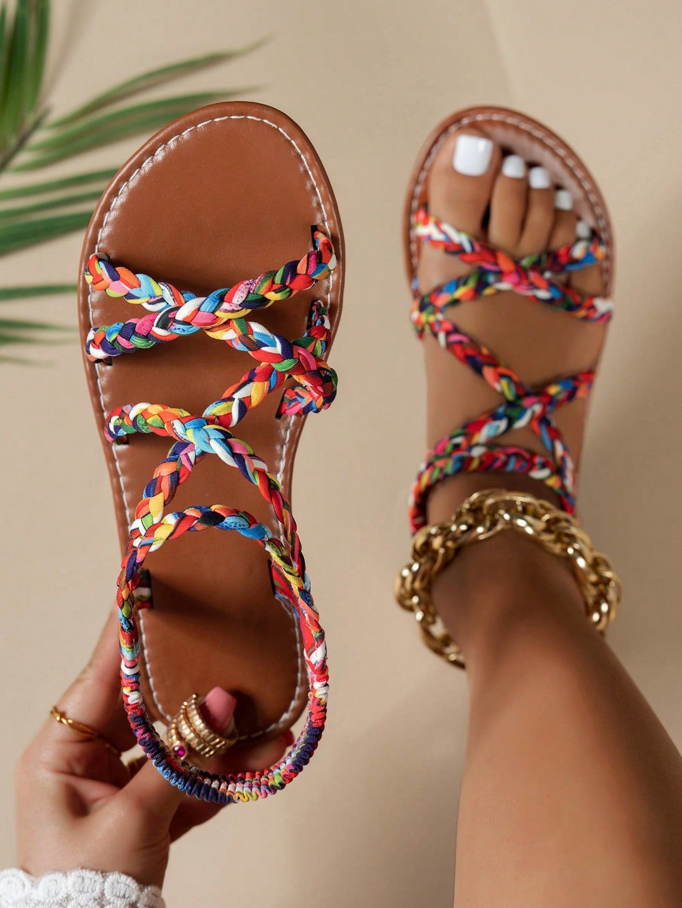 Pair of colorful woven strap flat sandals with an elastic back strap, open toe, and slip-on slide design for vacation, beach, and party wear.