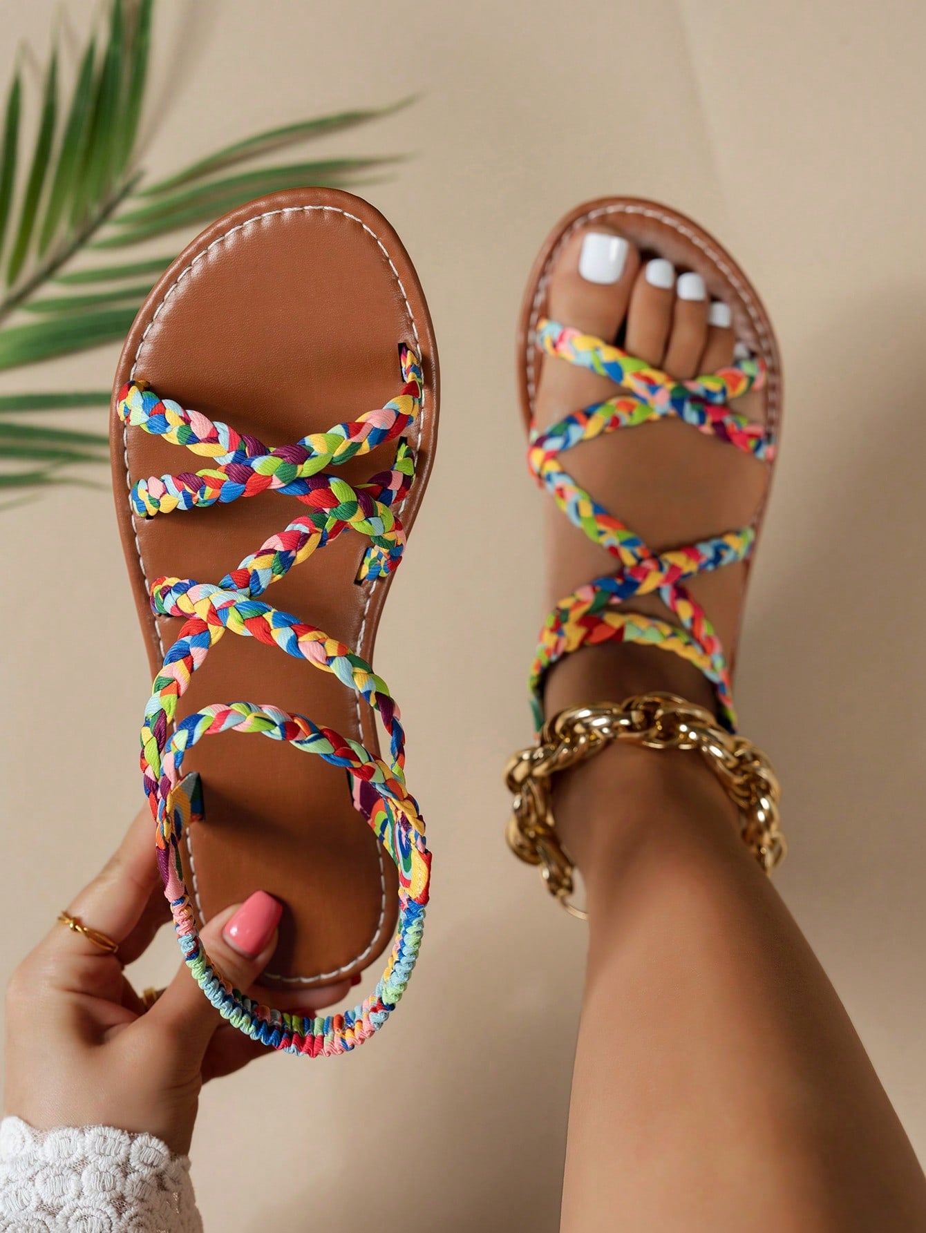 Pair of colorful woven strap flat sandals with an elastic back strap, open toe, and slip-on slide design for vacation, beach, and party wear.