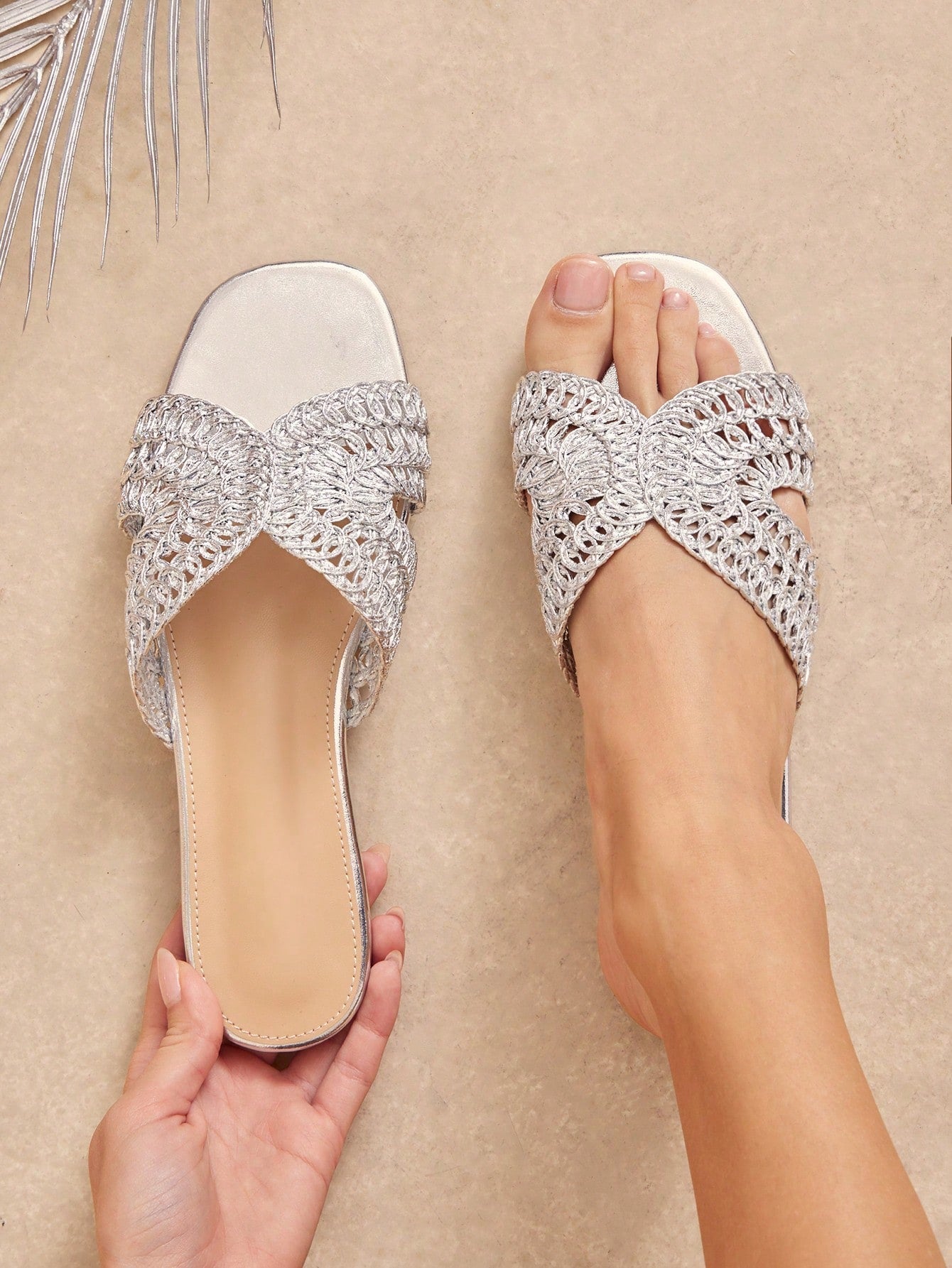 Women's slip-on flat slide sandals with open toe, woven one-band upper, and seashell and pearl ornaments in a marine life-inspired design.