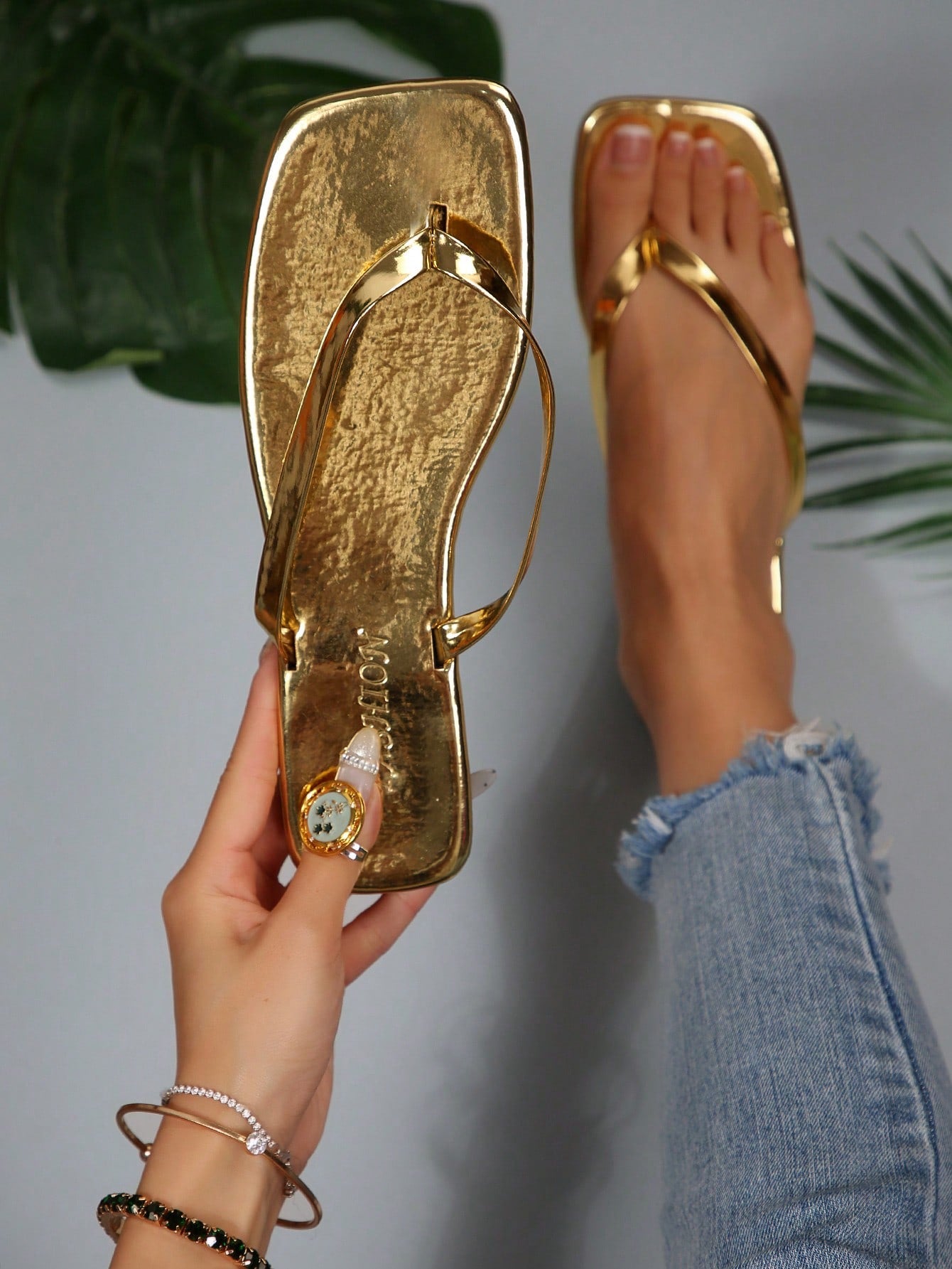Women's chocolate brown flat flip flop sandals featuring a toe-post thong style and braided detail, suitable for casual indoor and outdoor wear.
