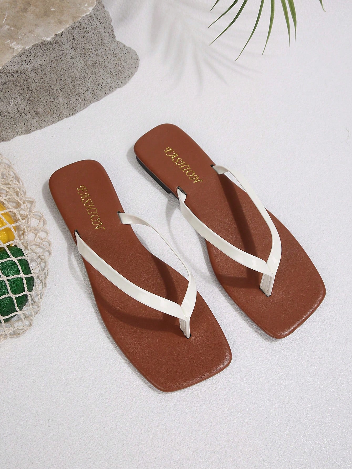 Women's chocolate brown flat flip flop sandals featuring a toe-post thong style and braided detail, suitable for casual indoor and outdoor wear.