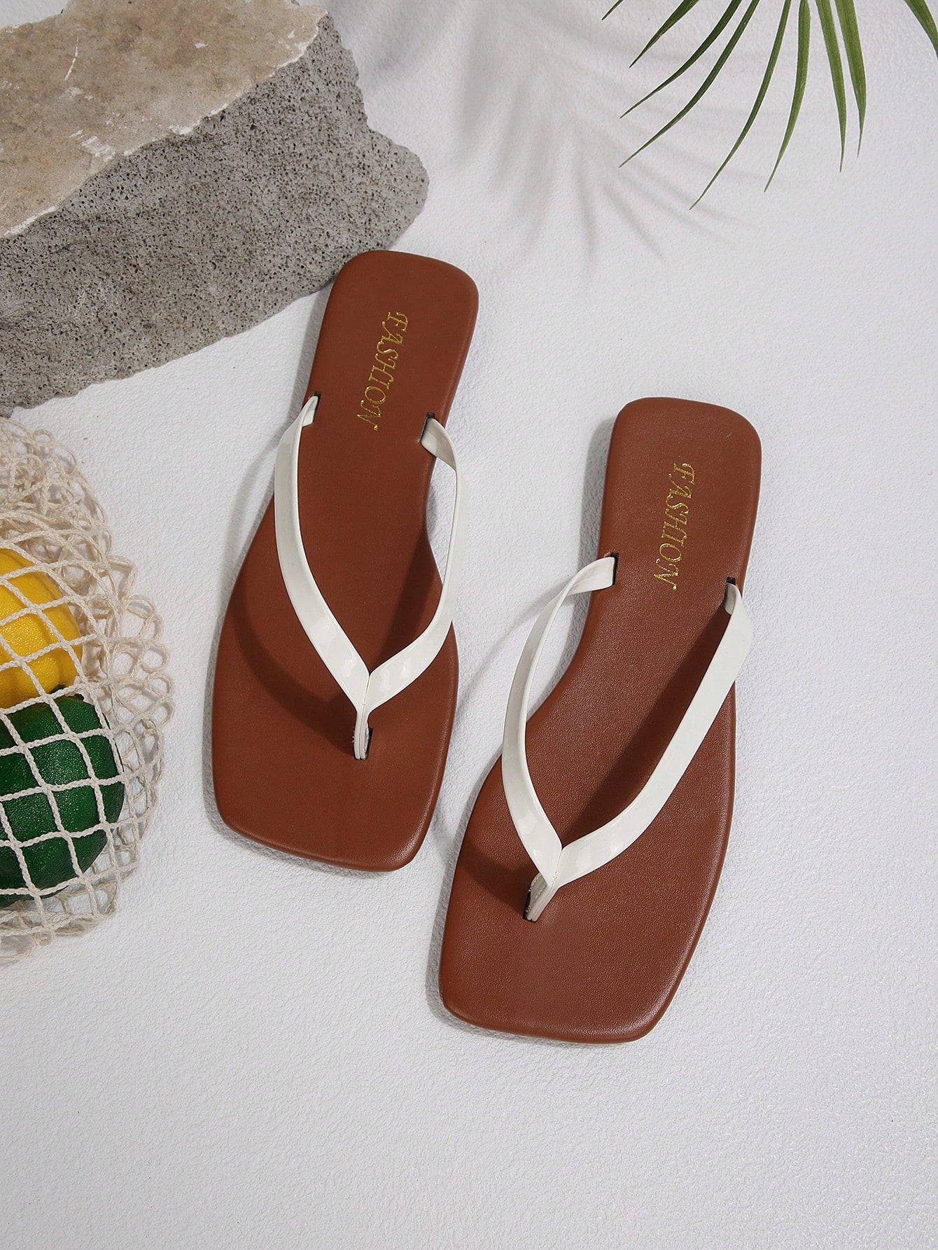Women's chocolate brown flat flip flop sandals featuring a toe-post thong style and braided detail, suitable for casual indoor and outdoor wear.