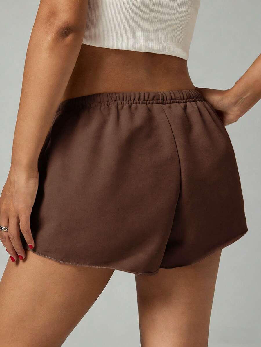 Petite women's burgundy casual track shorts with drawstring waist, raw hem, loose fit, and mini length