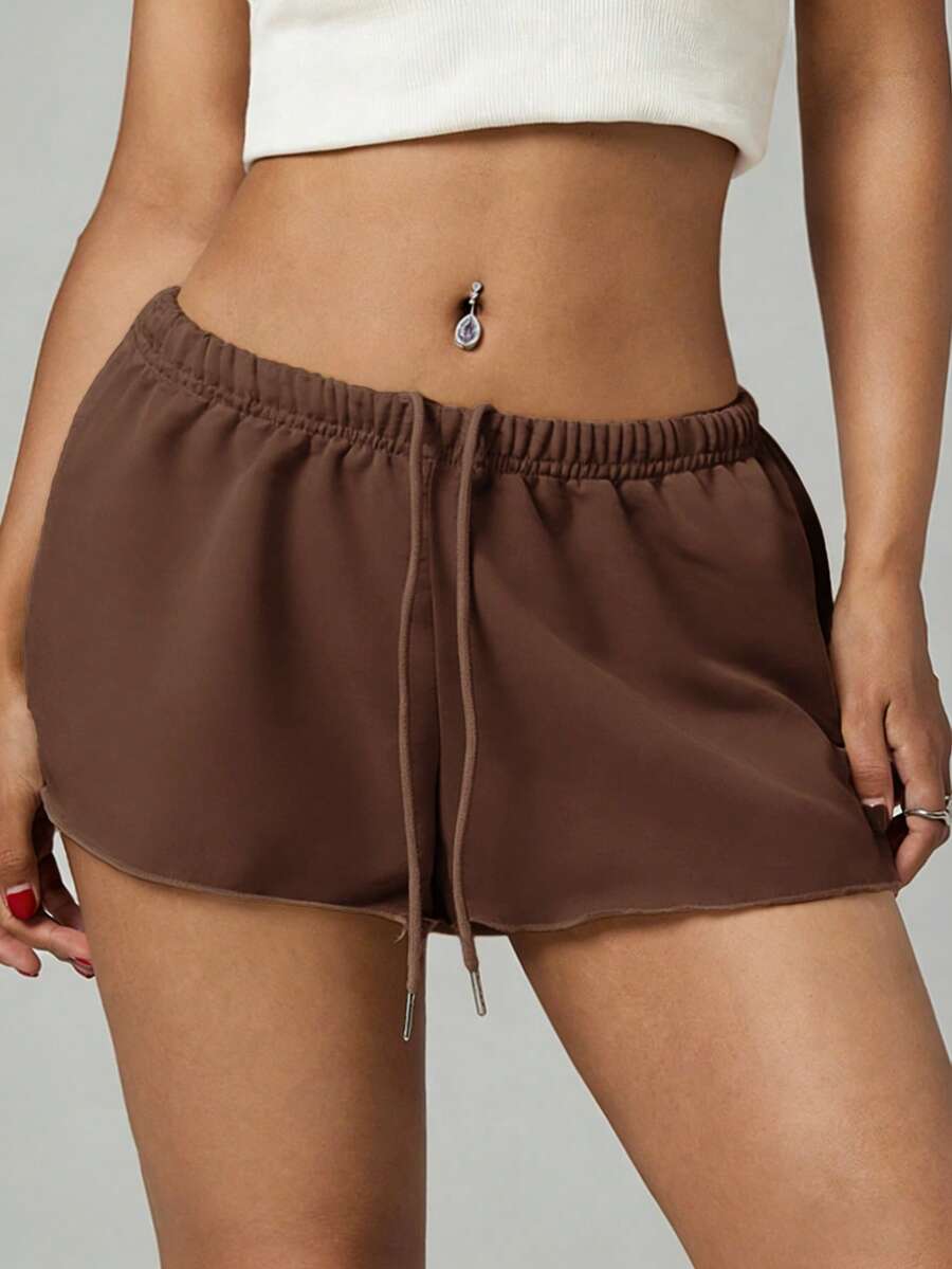 Petite women's burgundy casual track shorts with drawstring waist, raw hem, loose fit, and mini length