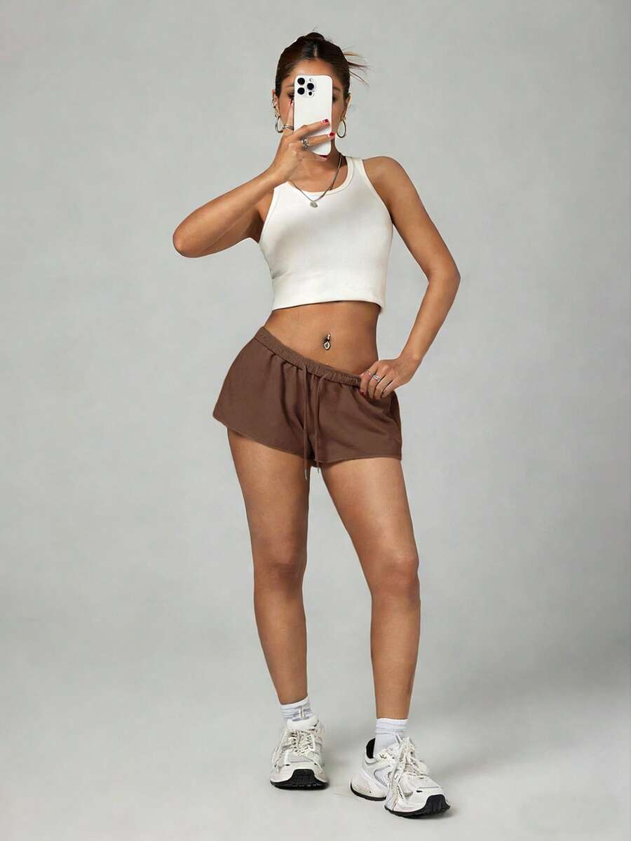 Petite women's burgundy casual track shorts with drawstring waist, raw hem, loose fit, and mini length