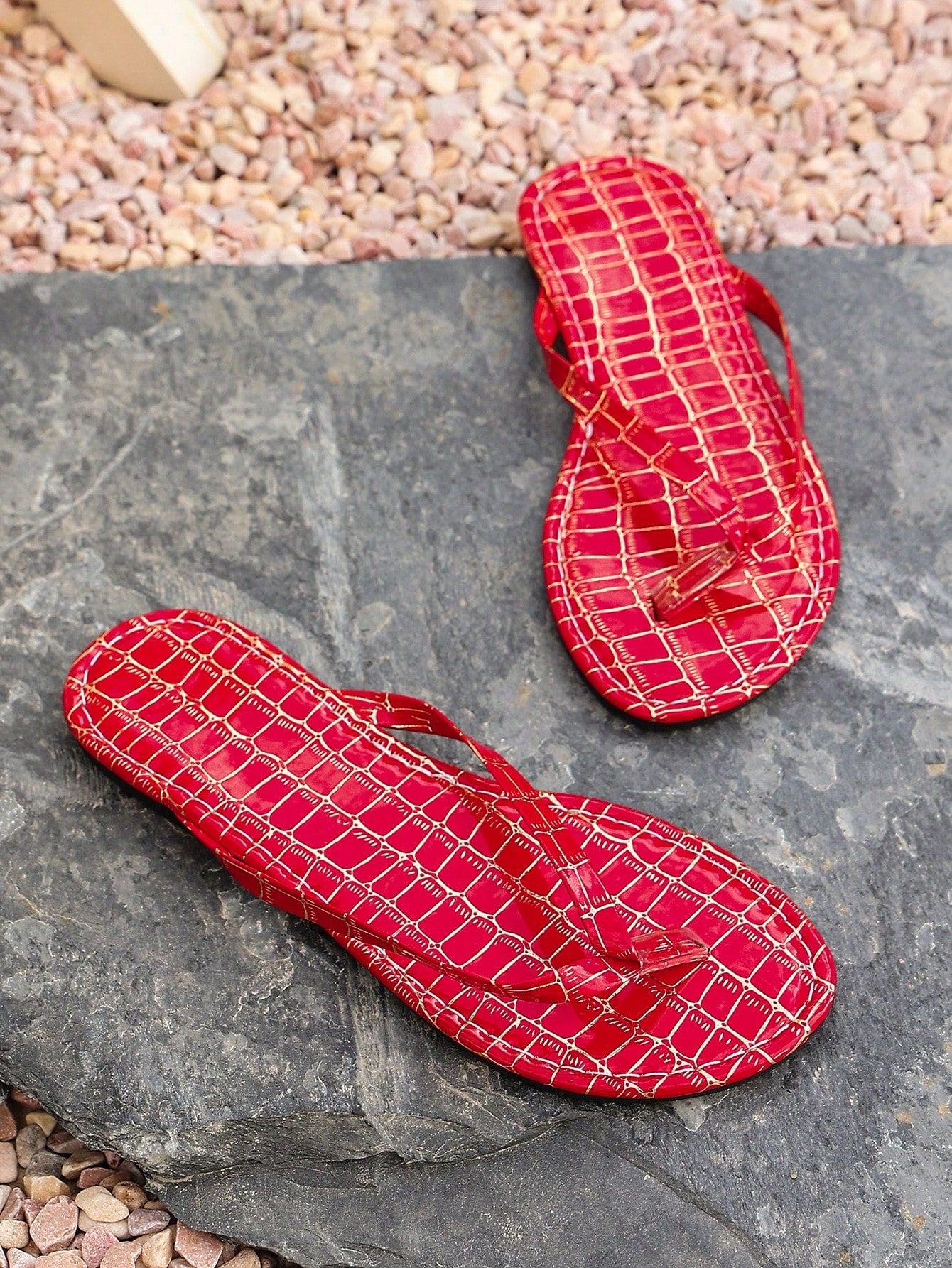 Women's criss cross thong flip flops with lace-up detail, flat sole, and non-slip outsole, suitable for beach, holiday, and casual walking wear.