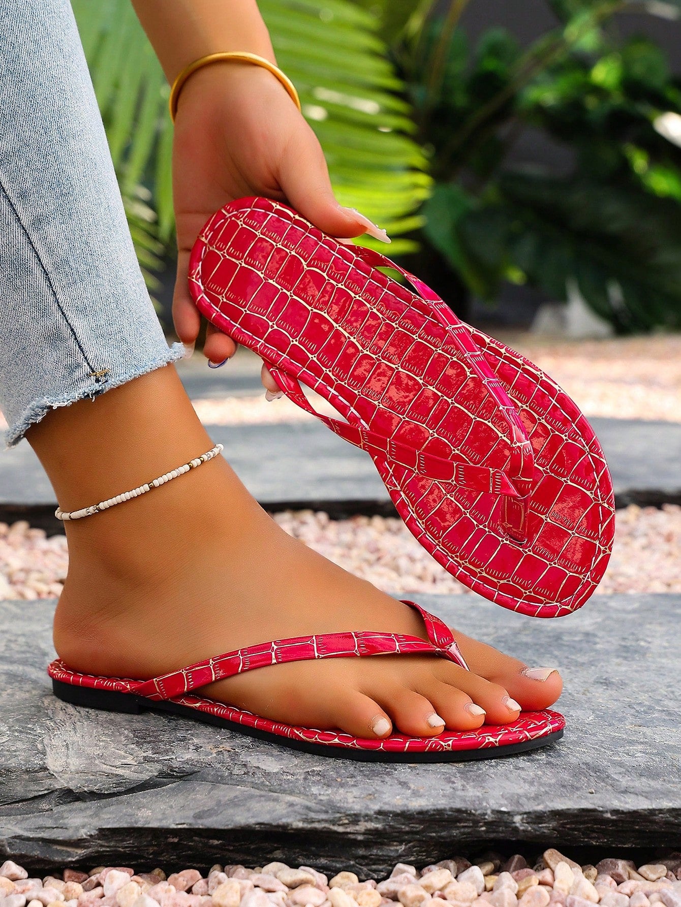 Women's criss cross thong flip flops with lace-up detail, flat sole, and non-slip outsole, suitable for beach, holiday, and casual walking wear.