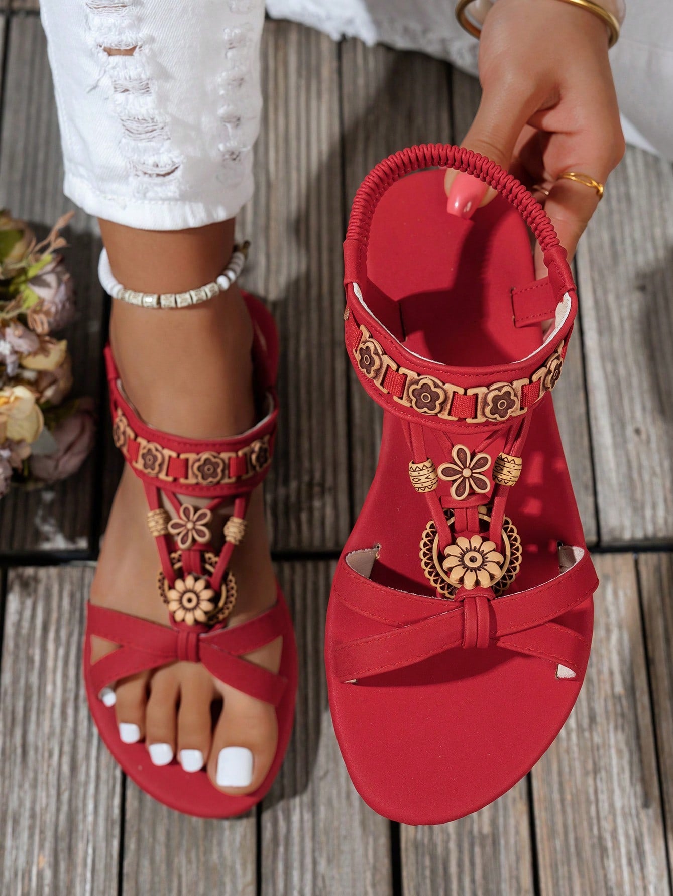 Women's flat slip-on sandals with open toe, plain solid-color look, beaded detail, and golden bar decor in a classic bohemian-inspired style.