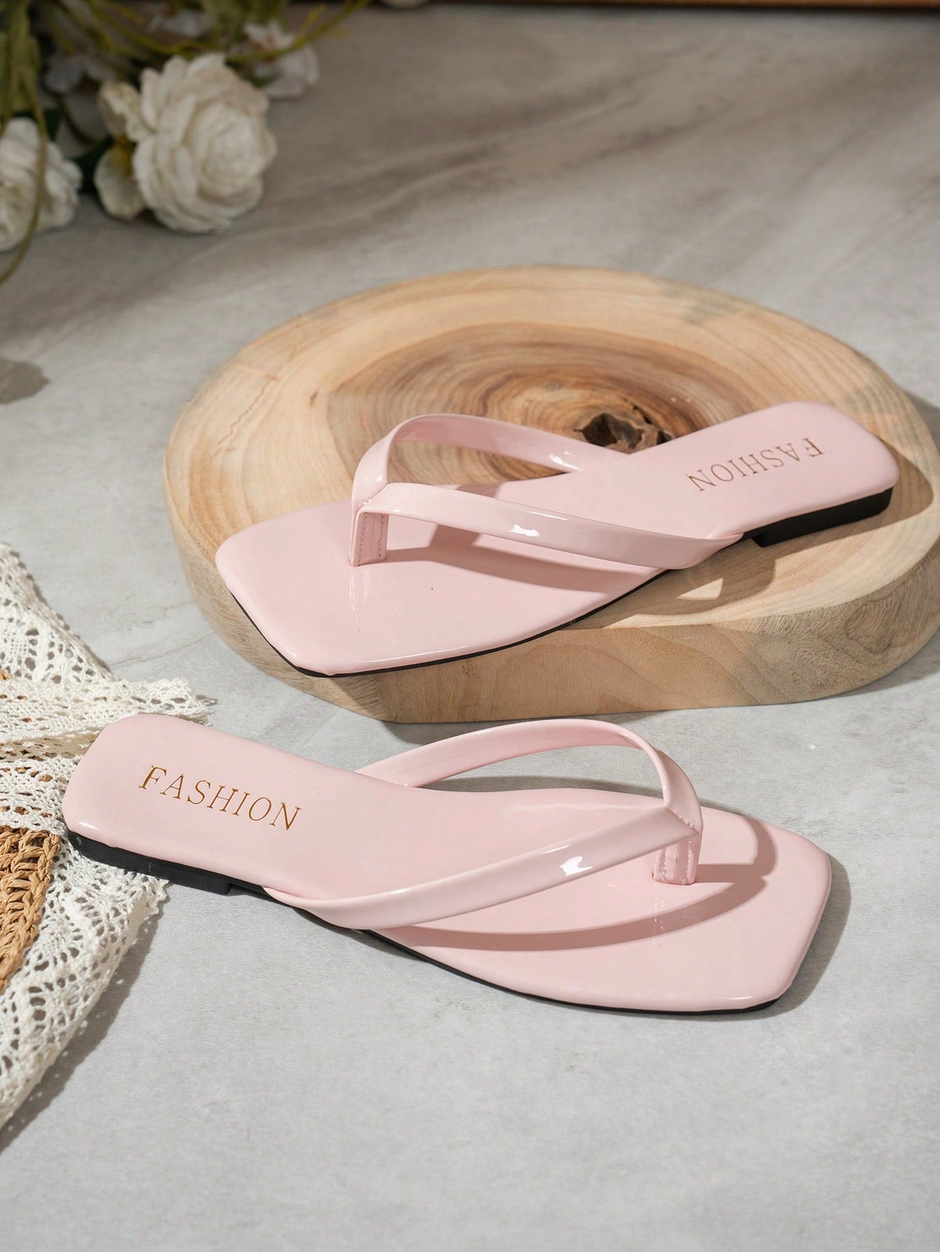 Women's square toe flip flop flat sandals featuring a toe-post design and criss cross strap detail, glossy fashion slides for beach, home, outing, and party wear.