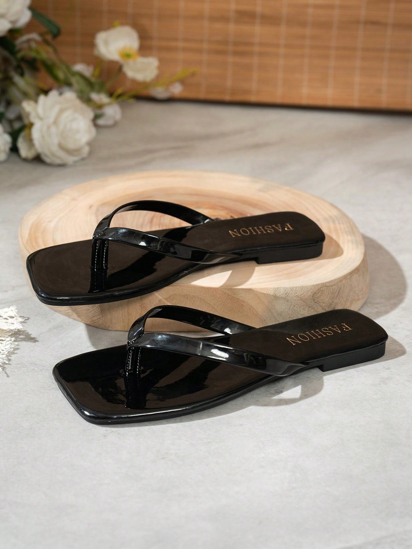 Women's square toe flip flop flat sandals featuring a toe-post design and criss cross strap detail, glossy fashion slides for beach, home, outing, and party wear.