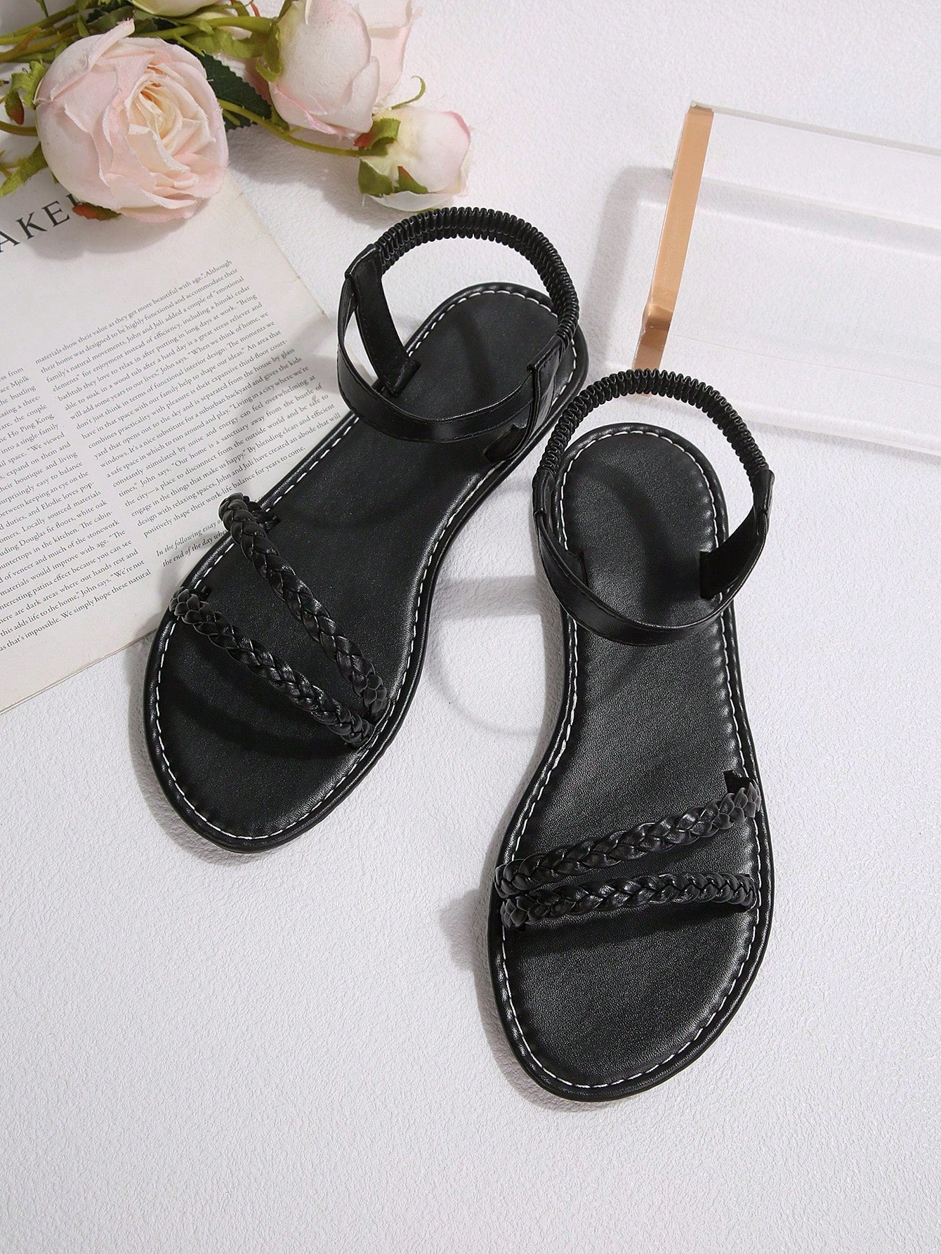 Plus size women's woven slip-on flat sandals with elastic straps, round toe, and minimalist slide design for casual outdoor or beach wear.