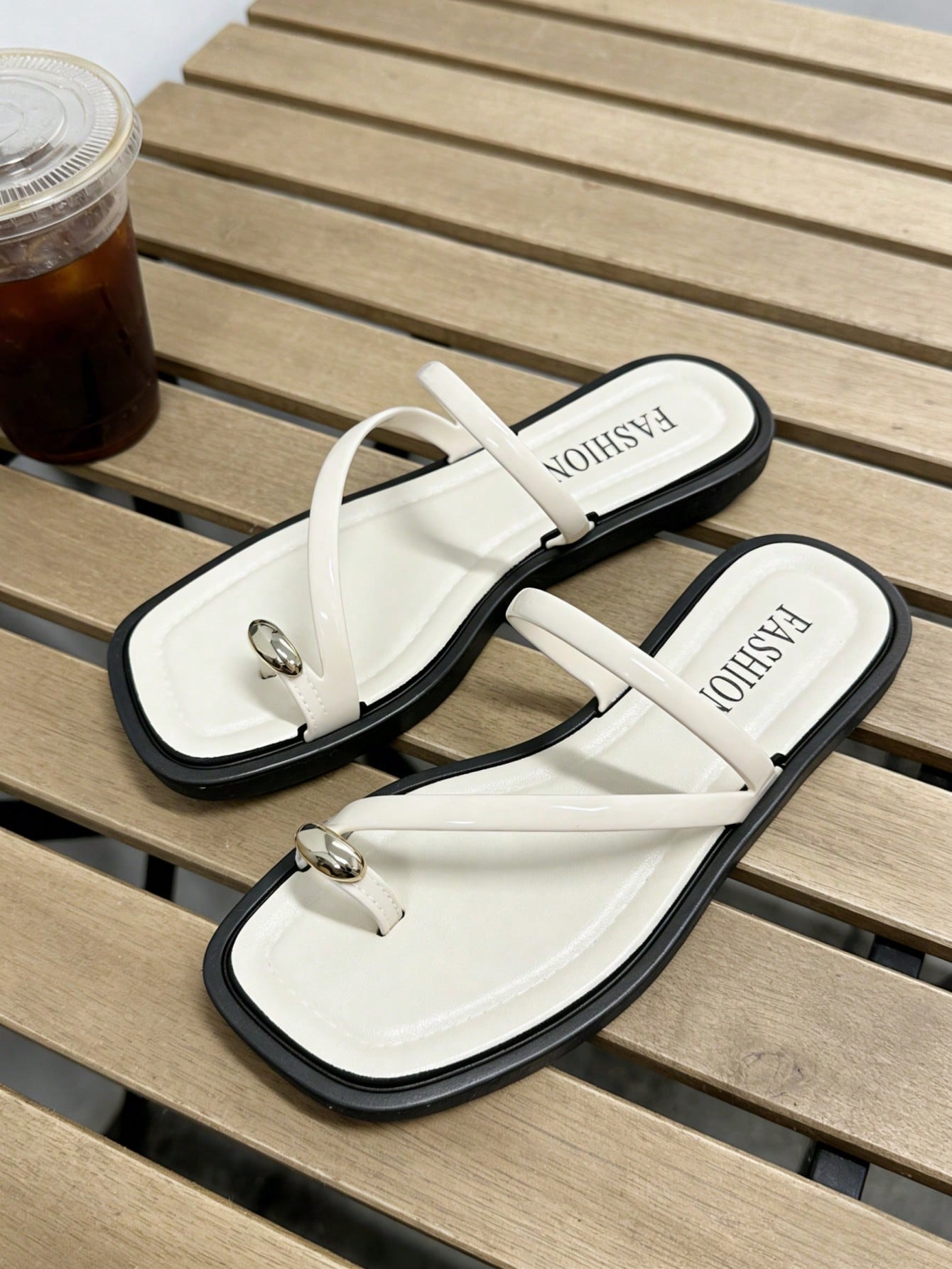 Women's flat toe-post sandals with cross-over straps and buckle detail, elegant outdoor style