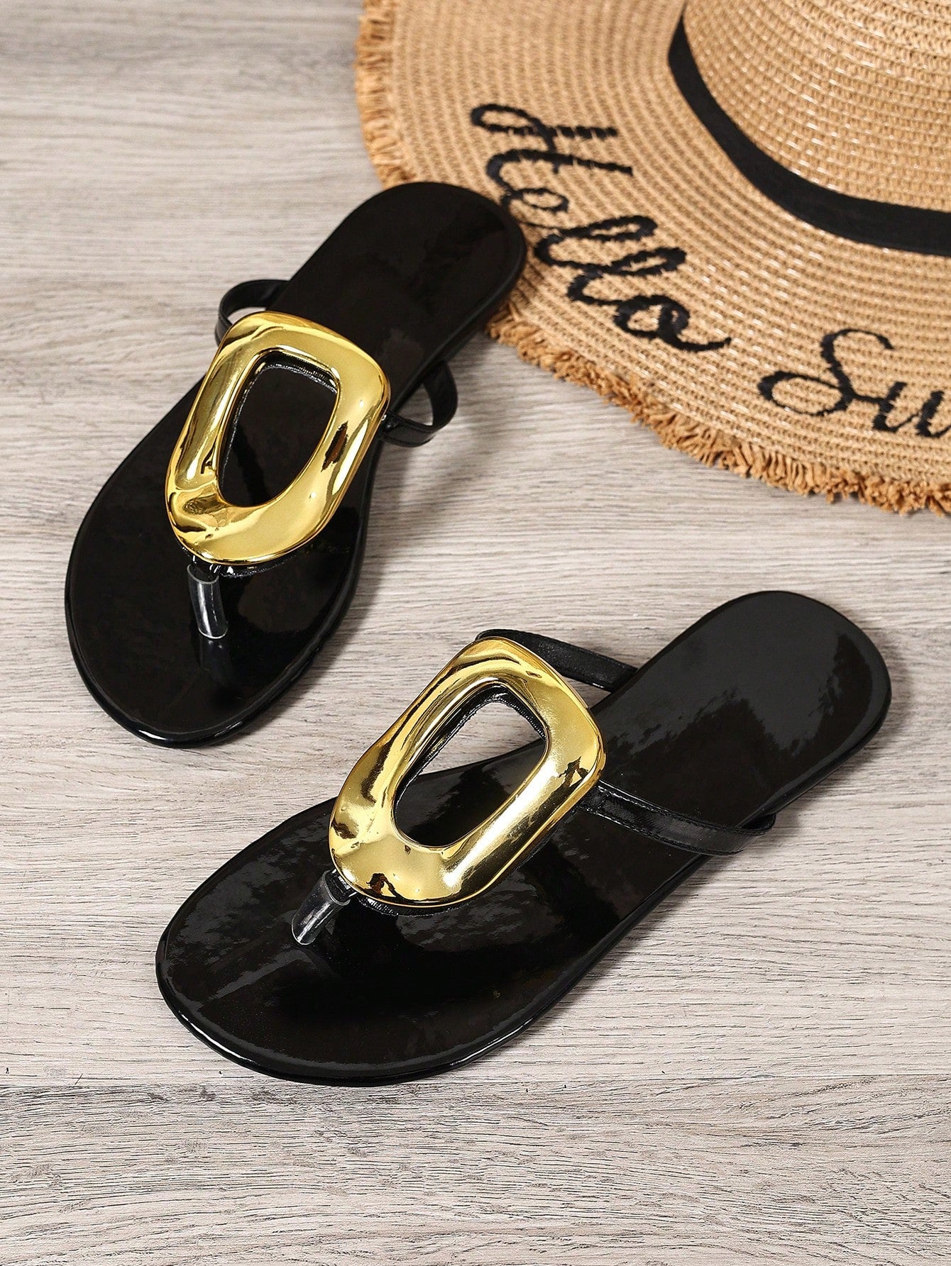 Black women's flat slide sandals with open toe design, decorated with pearl and rhinestone details.