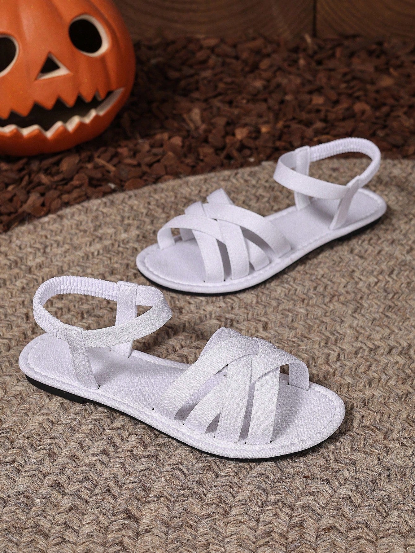 Women's flat thick sole gladiator sandals with cross adjustable straps and open toe, suitable for casual, vacation, and beach wear.