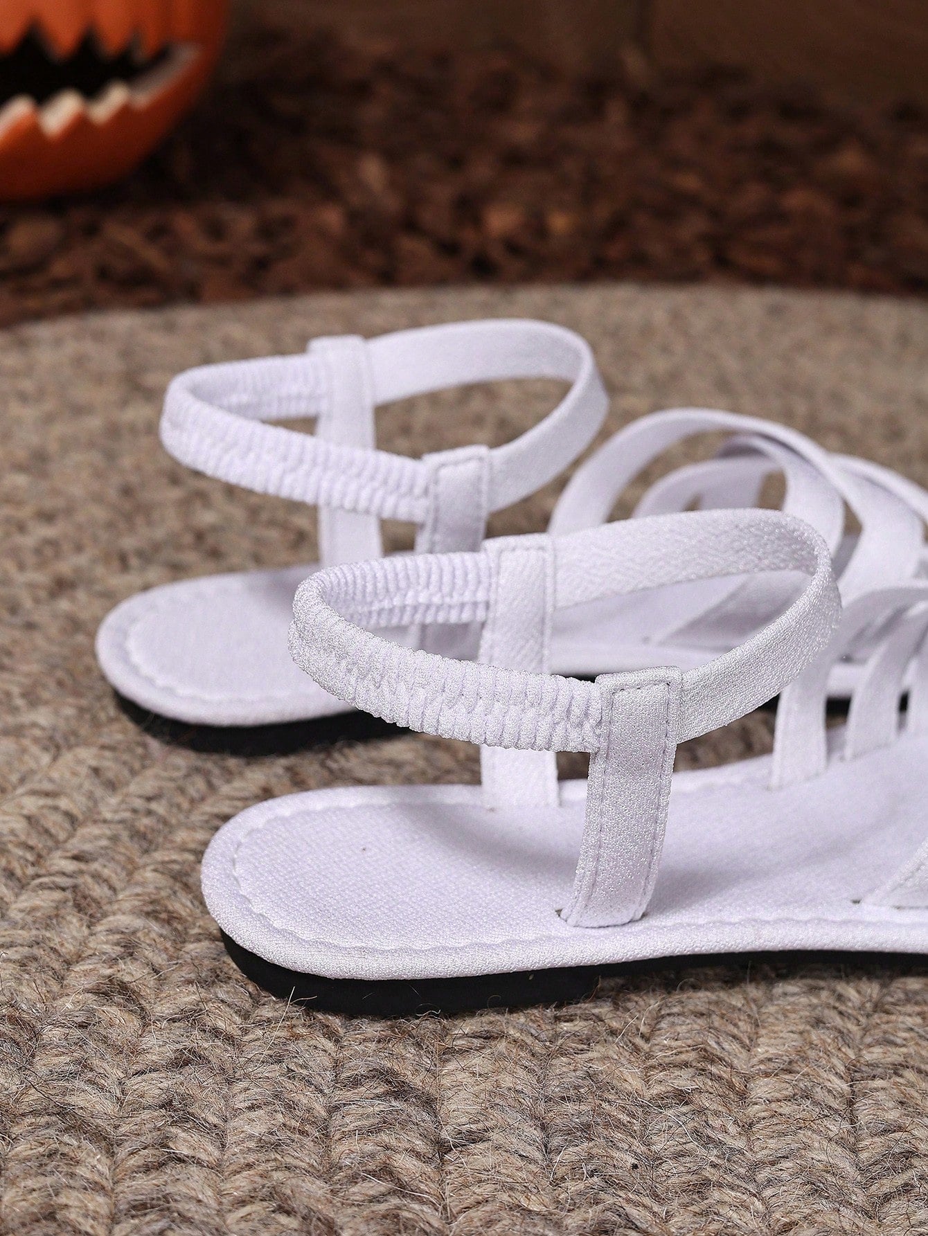 Women's flat thick sole gladiator sandals with cross adjustable straps and open toe, suitable for casual, vacation, and beach wear.