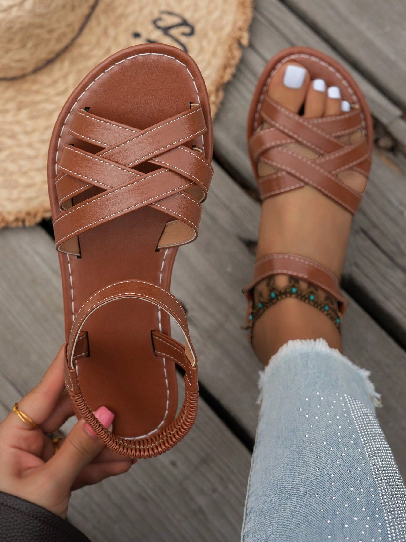 Women's flat thick sole gladiator sandals with cross adjustable straps and open toe, suitable for casual, vacation, and beach wear.