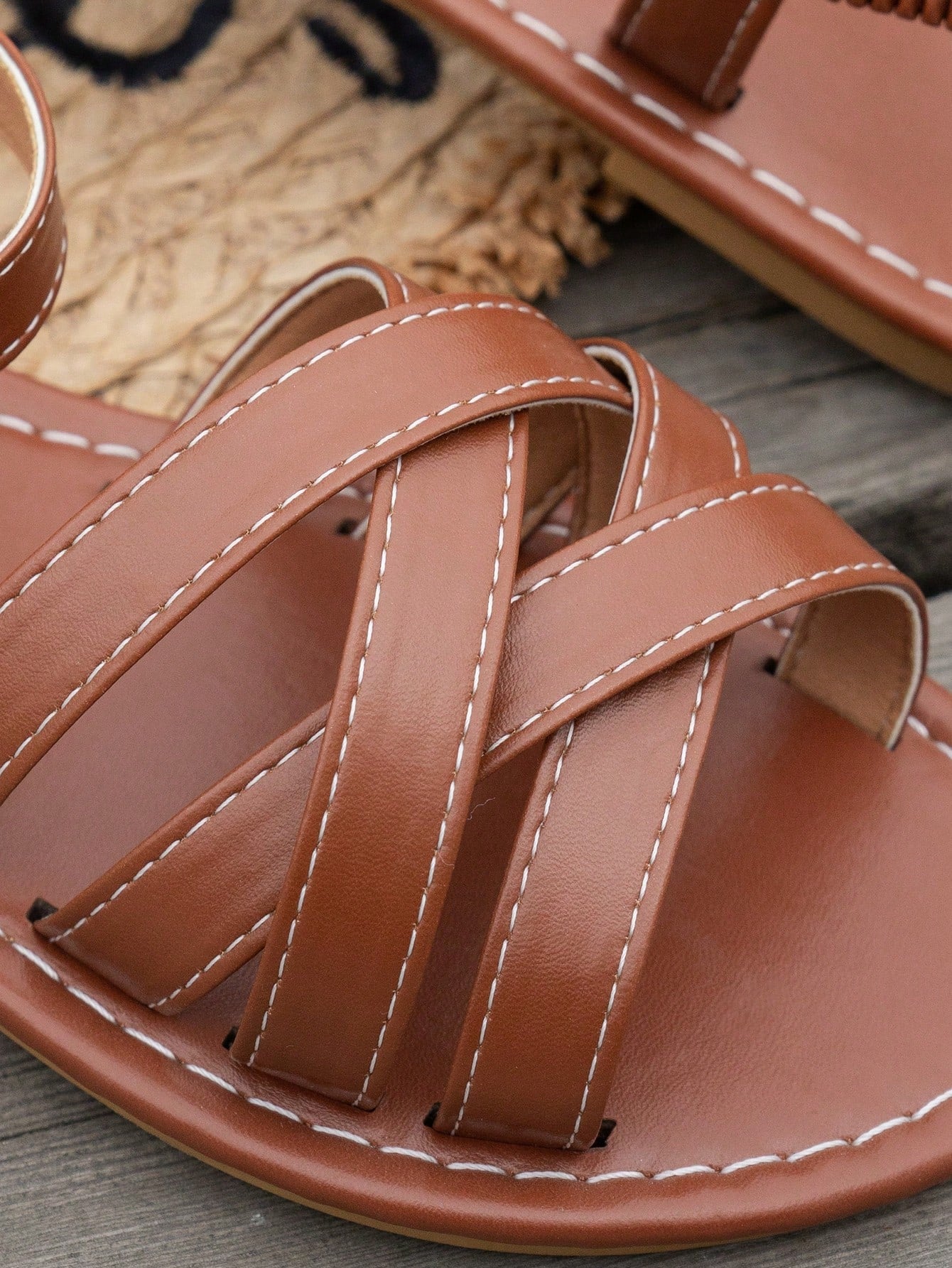 Women's flat thick sole gladiator sandals with cross adjustable straps and open toe, suitable for casual, vacation, and beach wear.