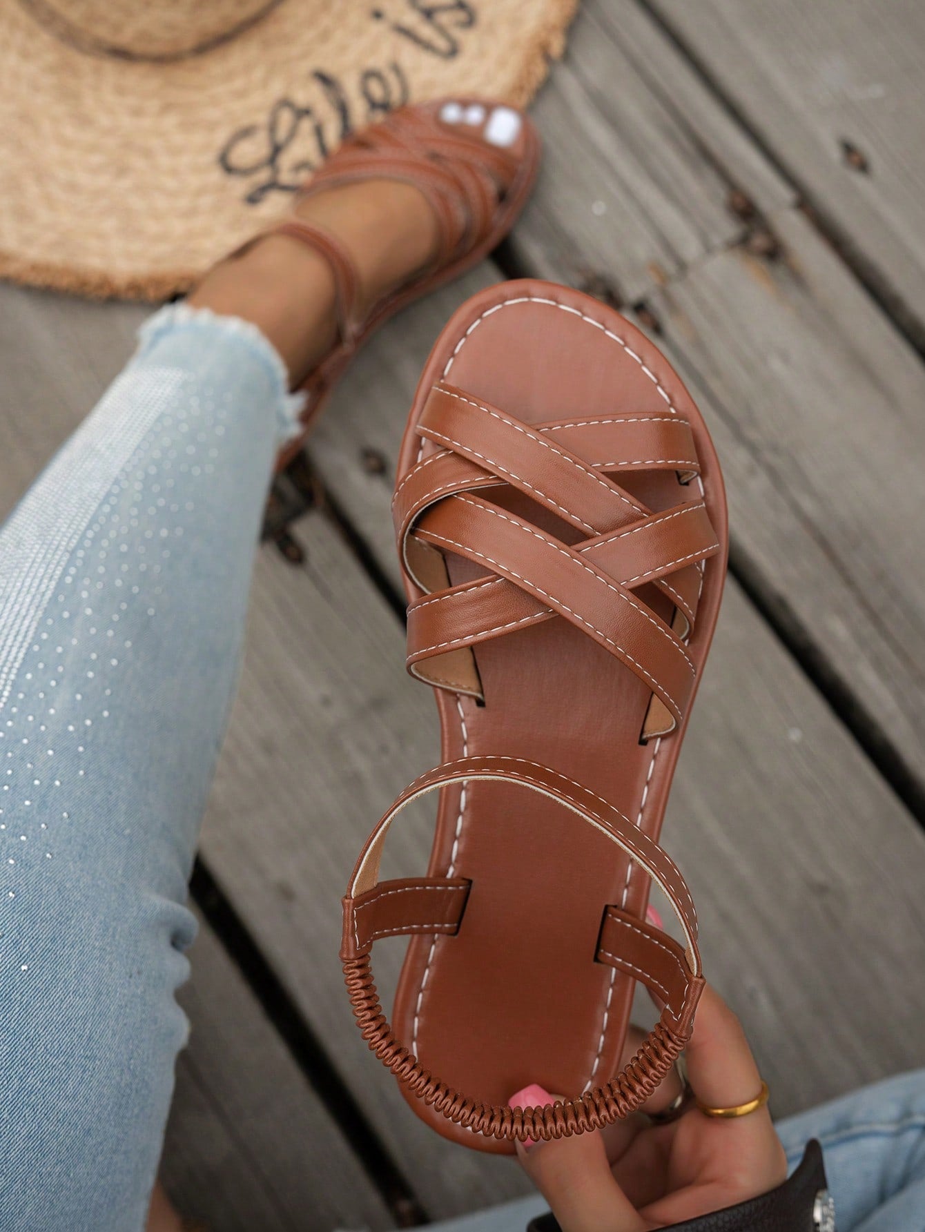 Women's flat thick sole gladiator sandals with cross adjustable straps and open toe, suitable for casual, vacation, and beach wear.