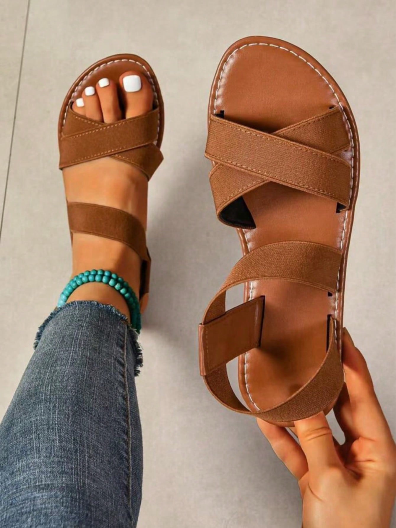 Women's flat thick sole gladiator sandals with cross adjustable straps and open toe, suitable for casual, vacation, and beach wear.