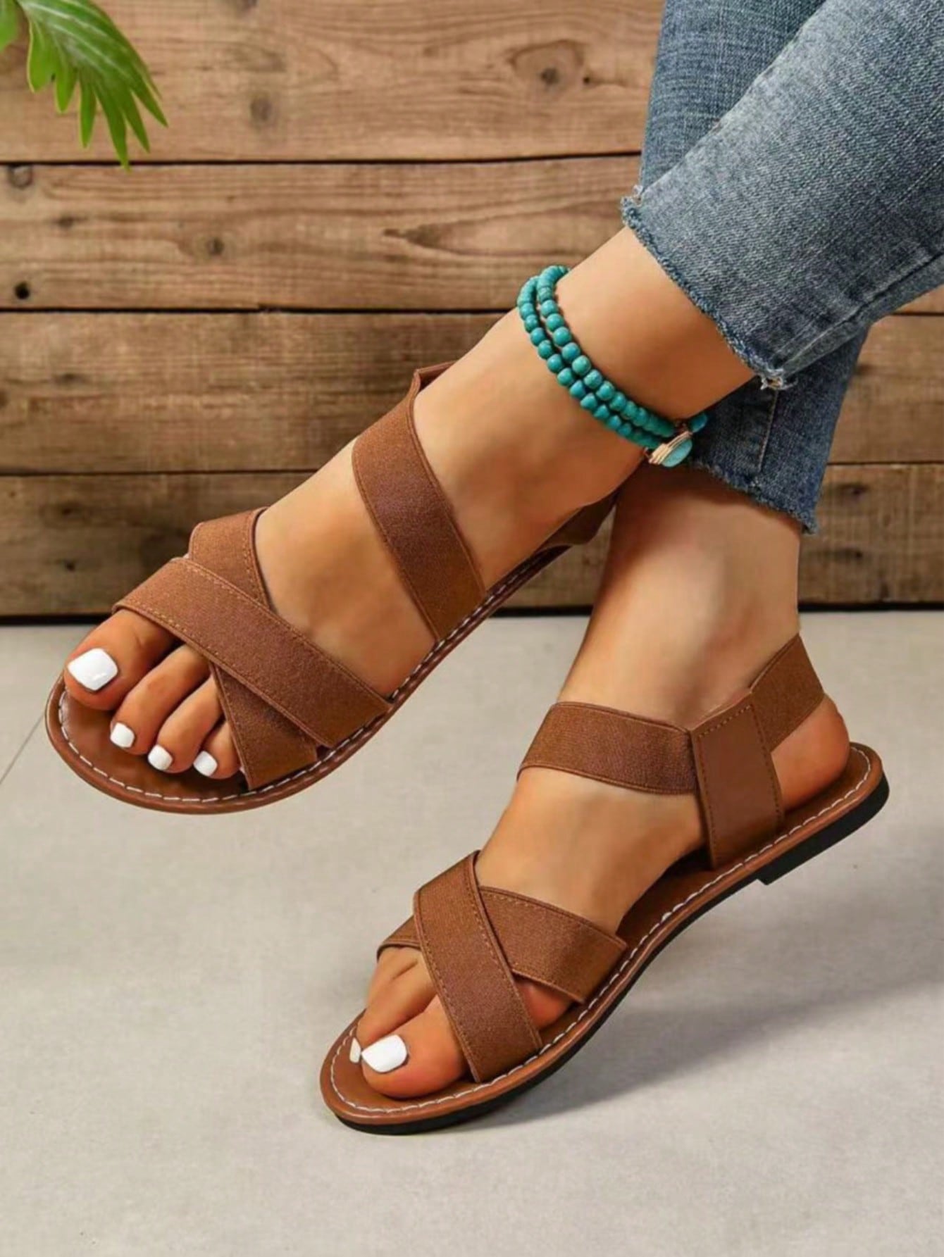 Women's flat thick sole gladiator sandals with cross adjustable straps and open toe, suitable for casual, vacation, and beach wear.