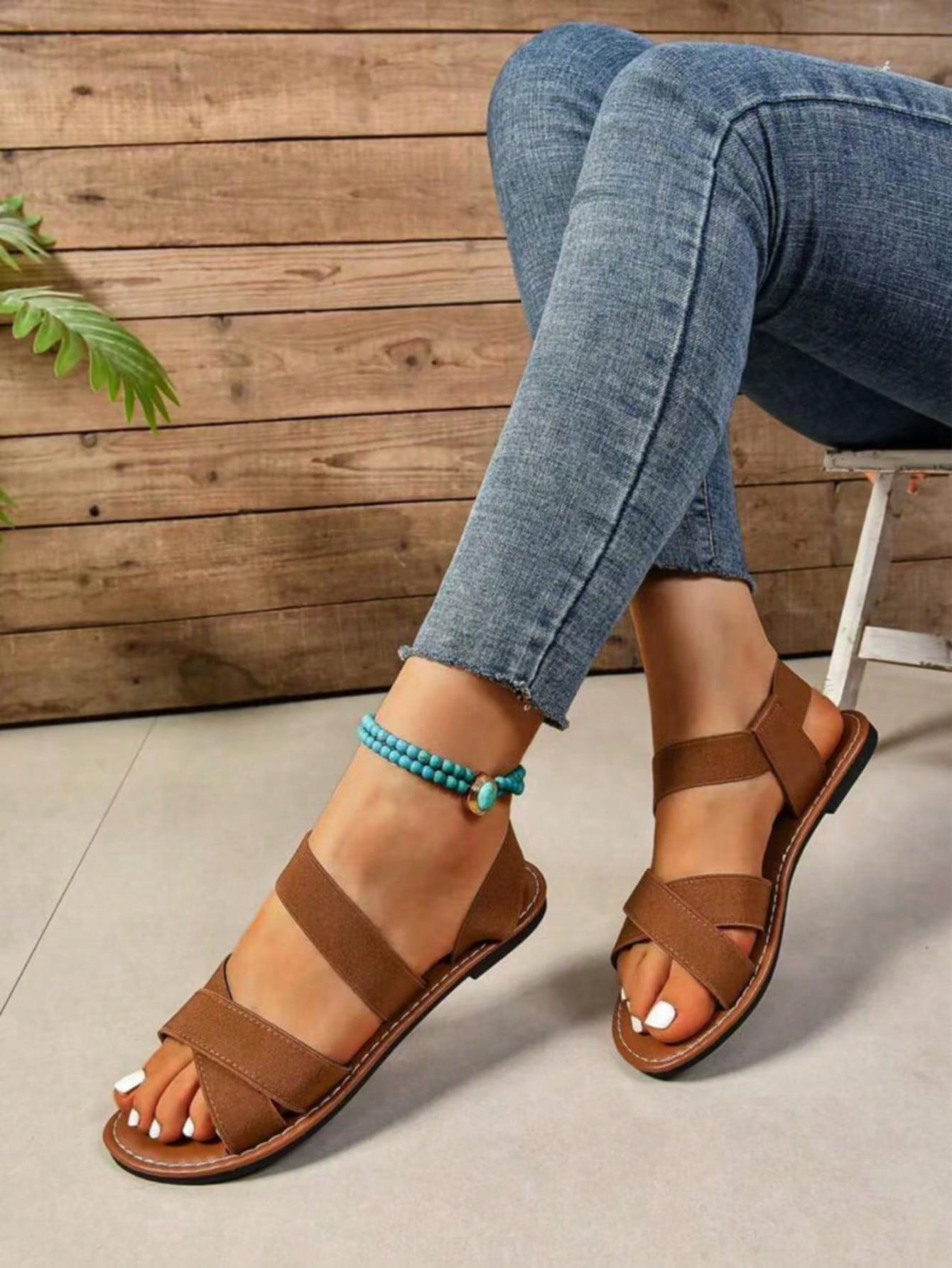 Women's flat thick sole gladiator sandals with cross adjustable straps and open toe, suitable for casual, vacation, and beach wear.