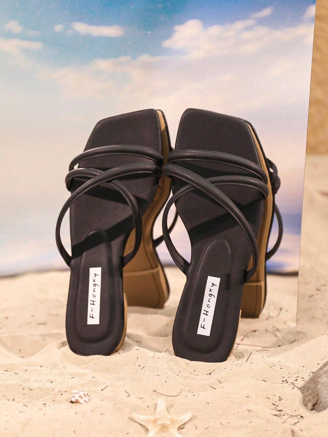 Women's slip-on flat slide sandals with bow tie decor, textured plain upper, and open toe.