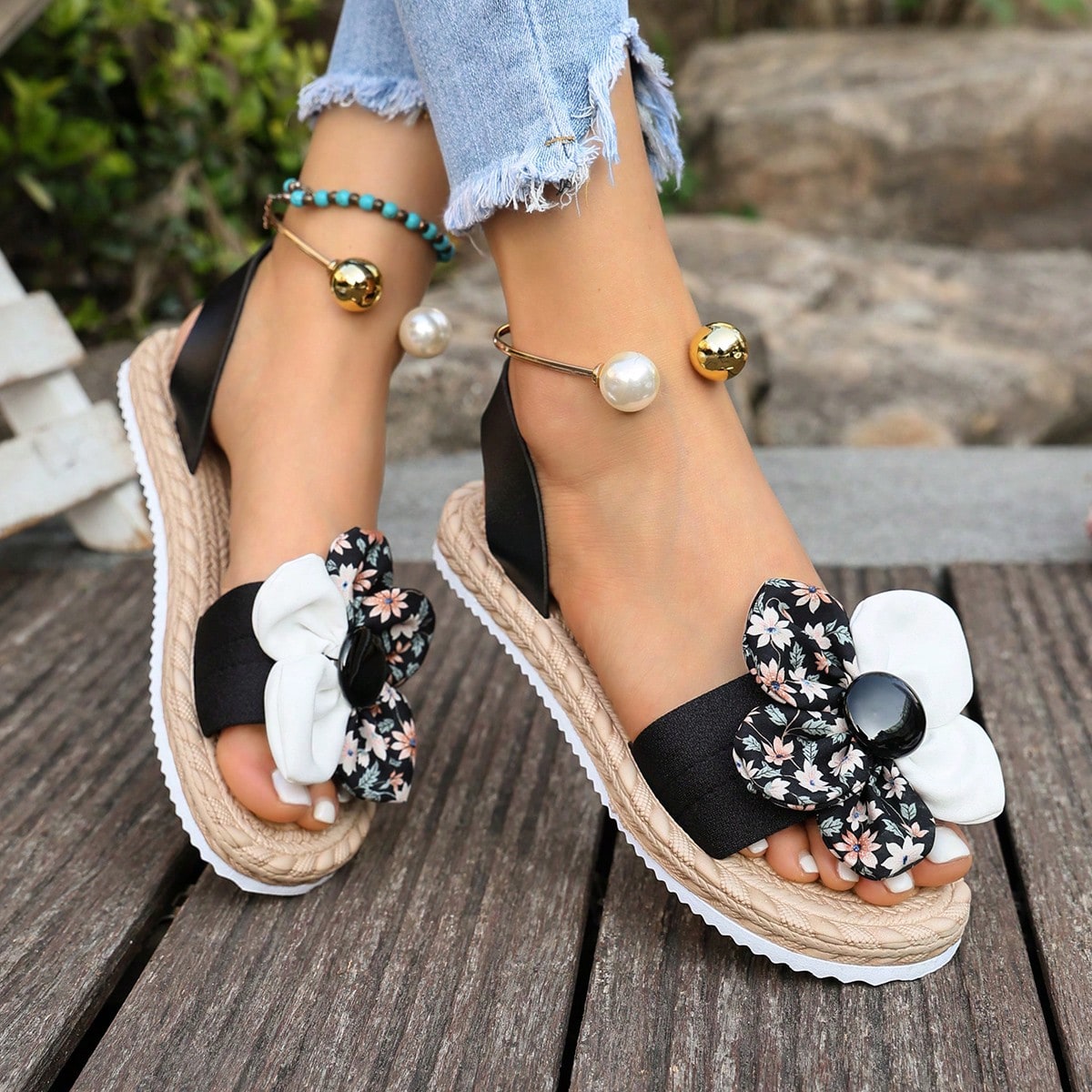 Women's floral beach slip-on flat sandals with soft non-slip sole and classic open sandal design in beige.