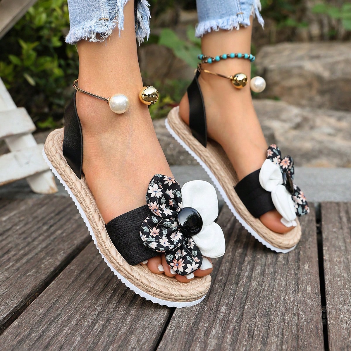 Women's floral beach slip-on flat sandals with soft non-slip sole and classic open sandal design in beige.