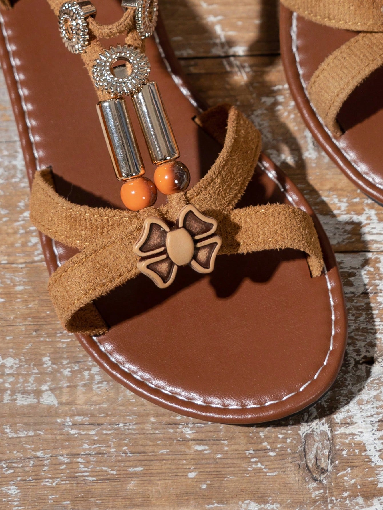Women's beaded open-toe thong flat sandals in slip-on style for outdoor and beach casual wear.