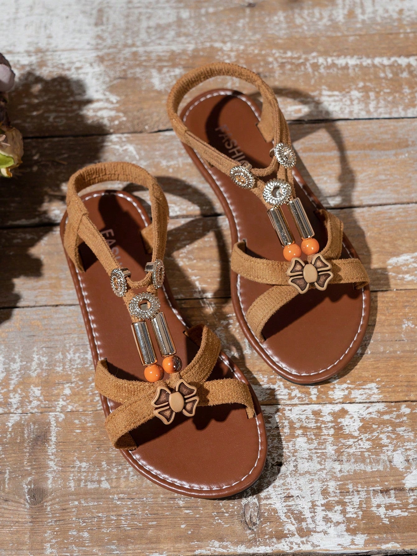 Women's beaded open-toe thong flat sandals in slip-on style for outdoor and beach casual wear.