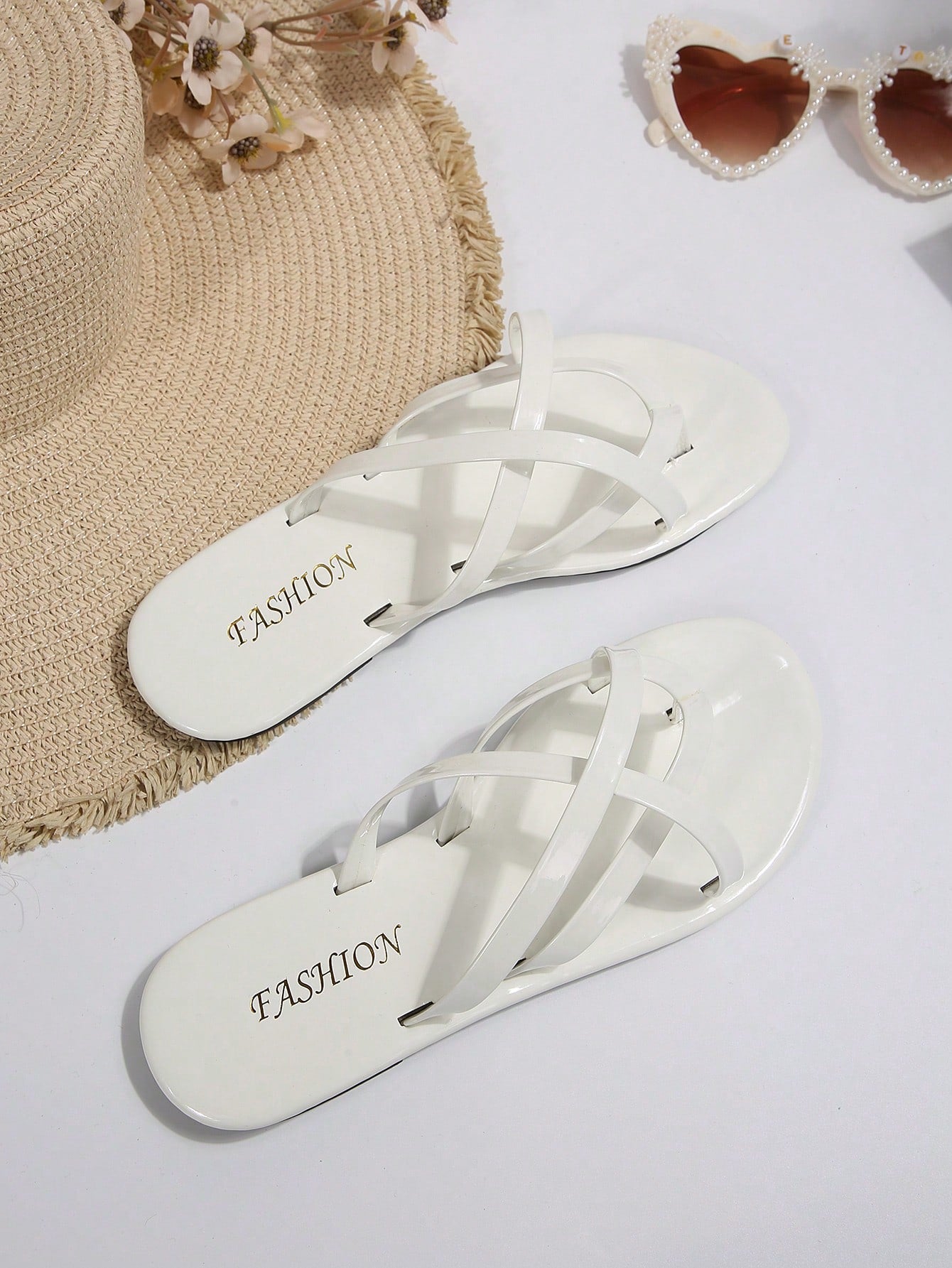Women's chocolate brown flat flip flop sandals featuring a toe-post thong style and braided detail, suitable for casual indoor and outdoor wear.