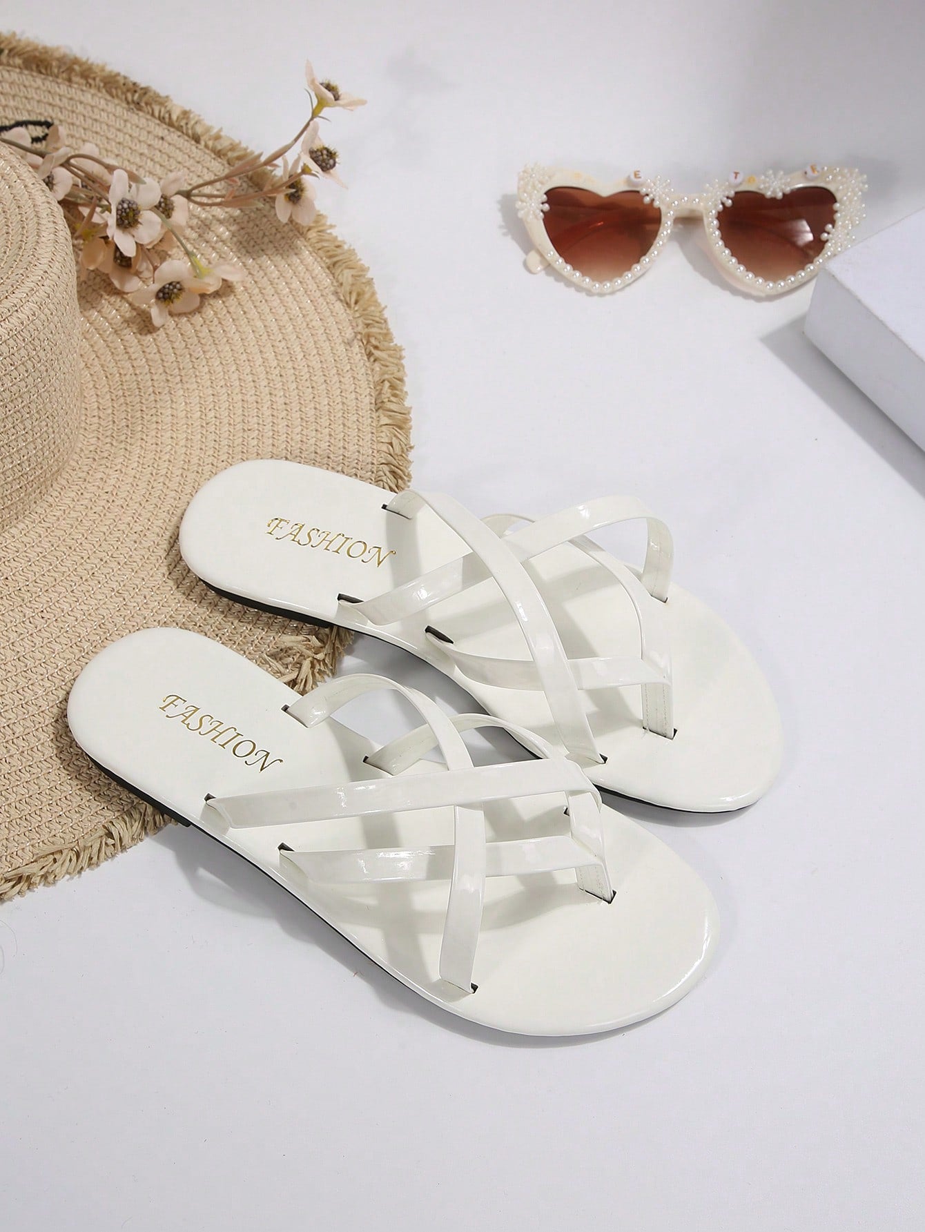 Women's chocolate brown flat flip flop sandals featuring a toe-post thong style and braided detail, suitable for casual indoor and outdoor wear.