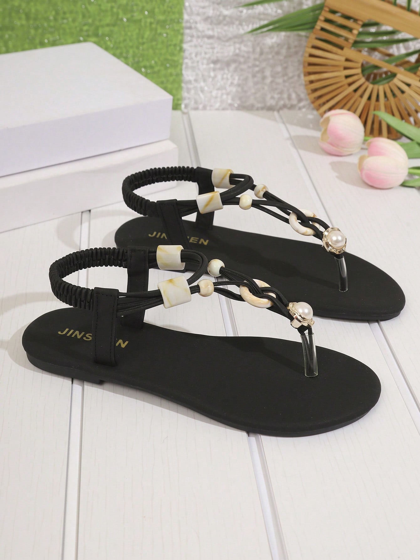 Women's beaded woven flip flop thong sandals with flat soft sole, toe-post design, and beach-style plant pattern detailing.