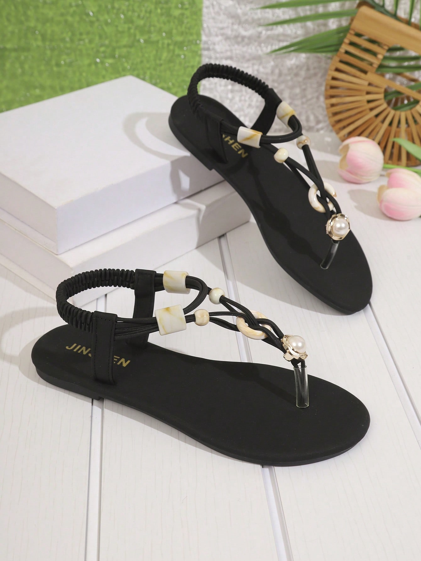 Women's beaded woven flip flop thong sandals with flat soft sole, toe-post design, and beach-style plant pattern detailing.