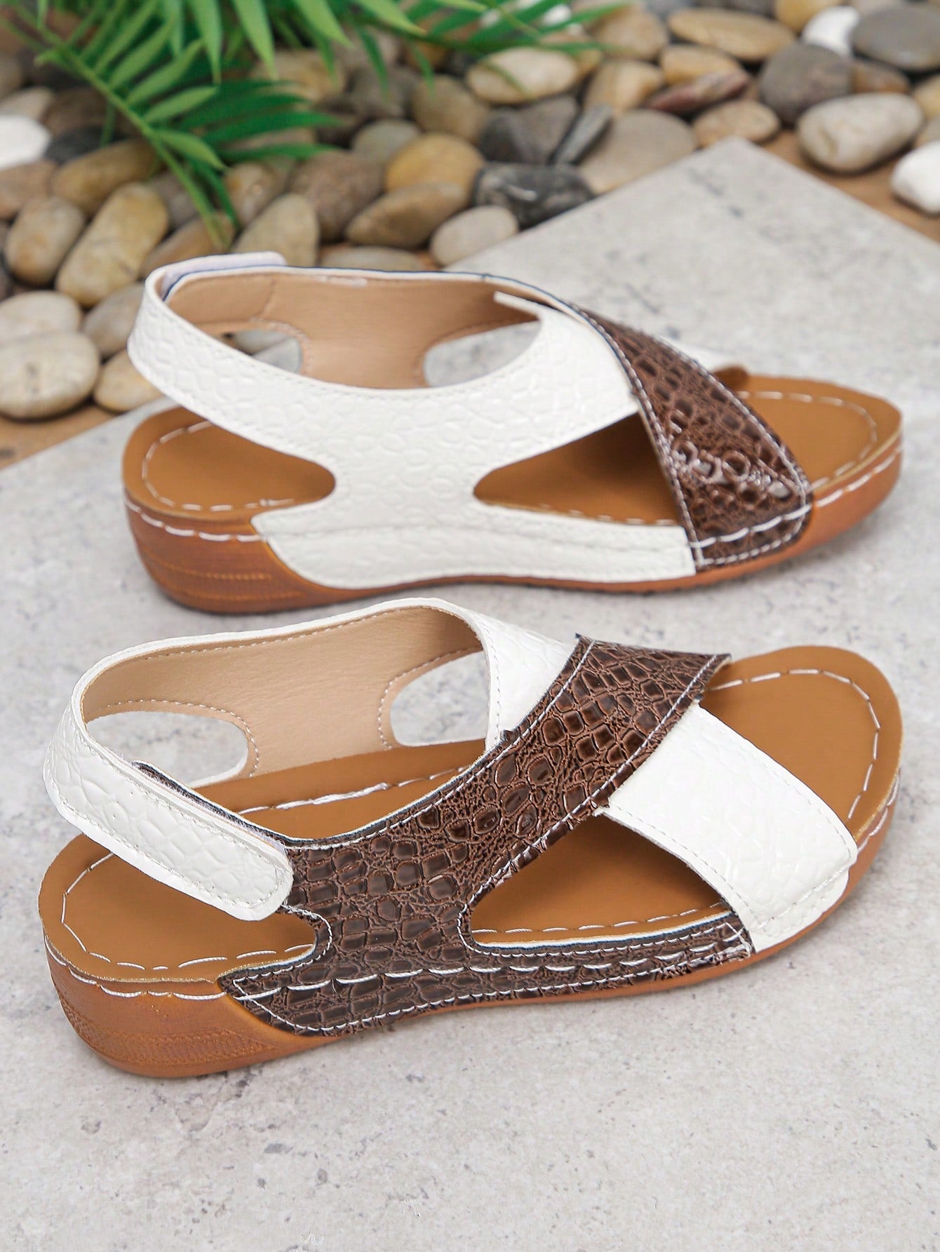 Pair of women’s plus size platform wedge sandals with round toe, criss-cross straps, hook-and-loop Velcro closure, and textured crocodile-embossed PU upper, designed for beach and vacation wear.