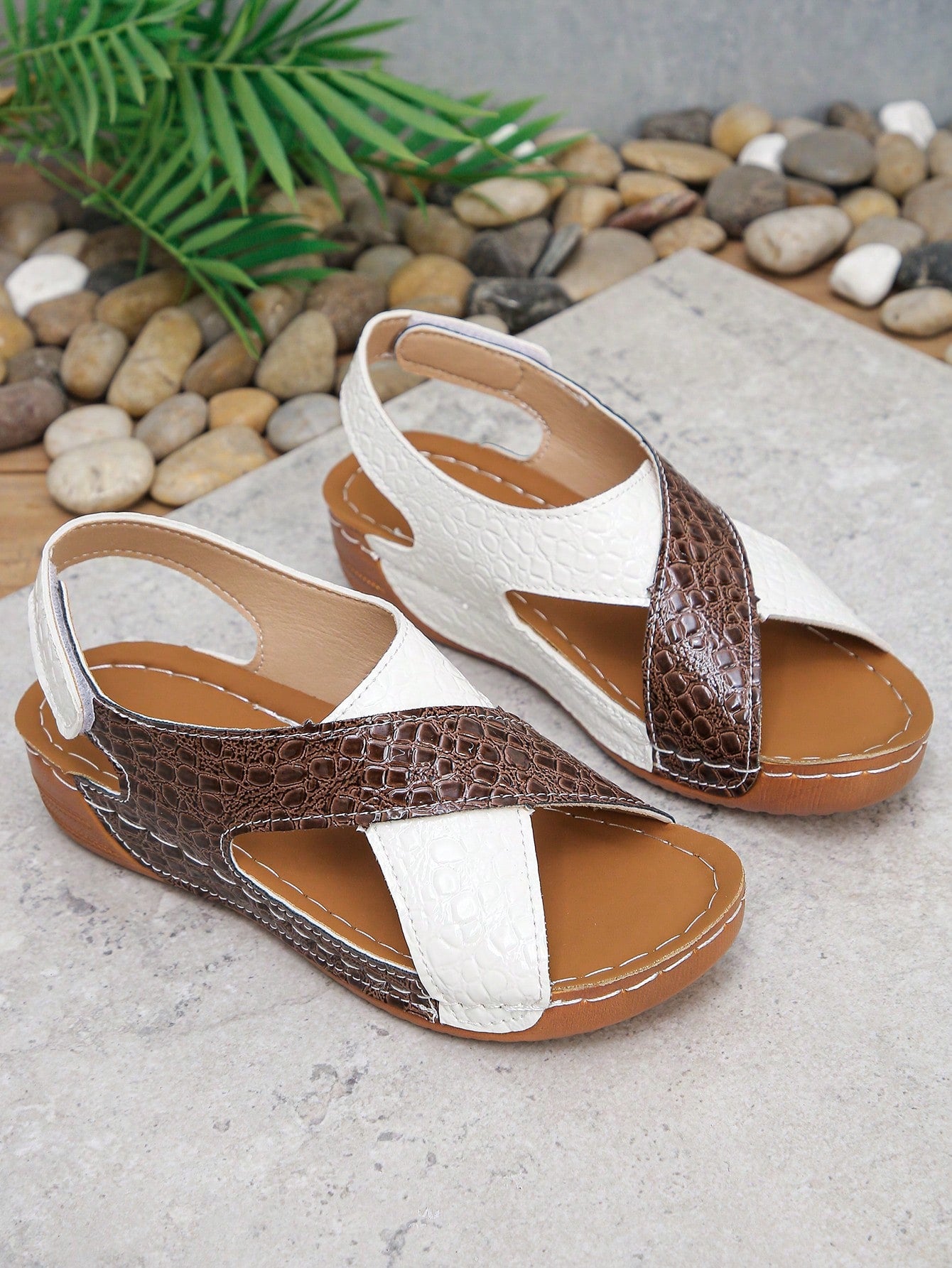 Pair of women’s plus size platform wedge sandals with round toe, criss-cross straps, hook-and-loop Velcro closure, and textured crocodile-embossed PU upper, designed for beach and vacation wear.