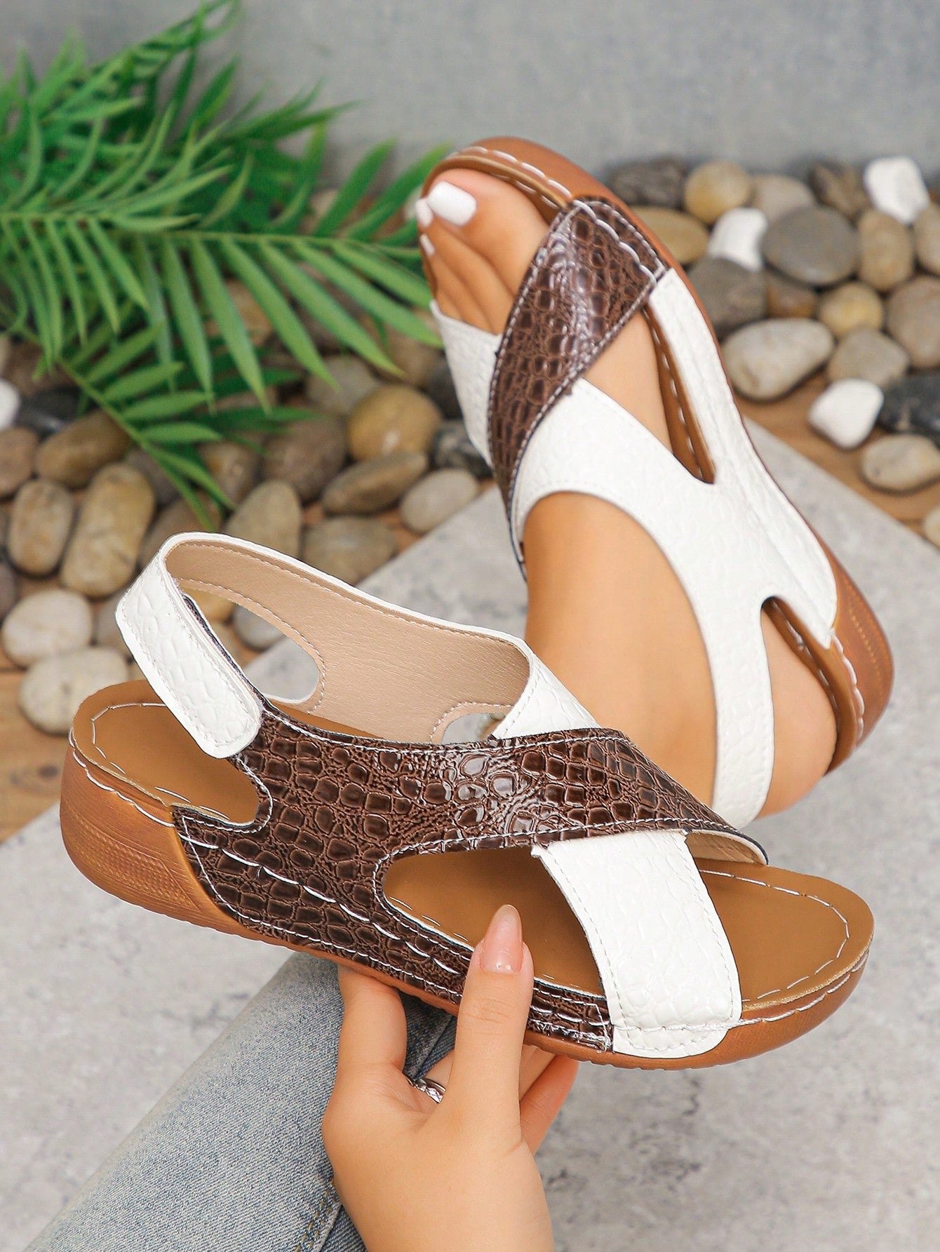 Pair of women’s plus size platform wedge sandals with round toe, criss-cross straps, hook-and-loop Velcro closure, and textured crocodile-embossed PU upper, designed for beach and vacation wear.
