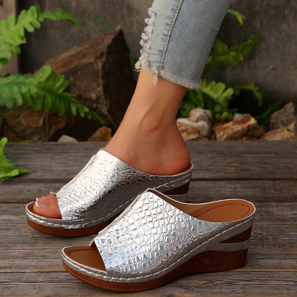 Women’s open-toe wedge slide sandals with hollow-out detail and plain design, one-piece PU leather upper, suitable for outdoor wear.