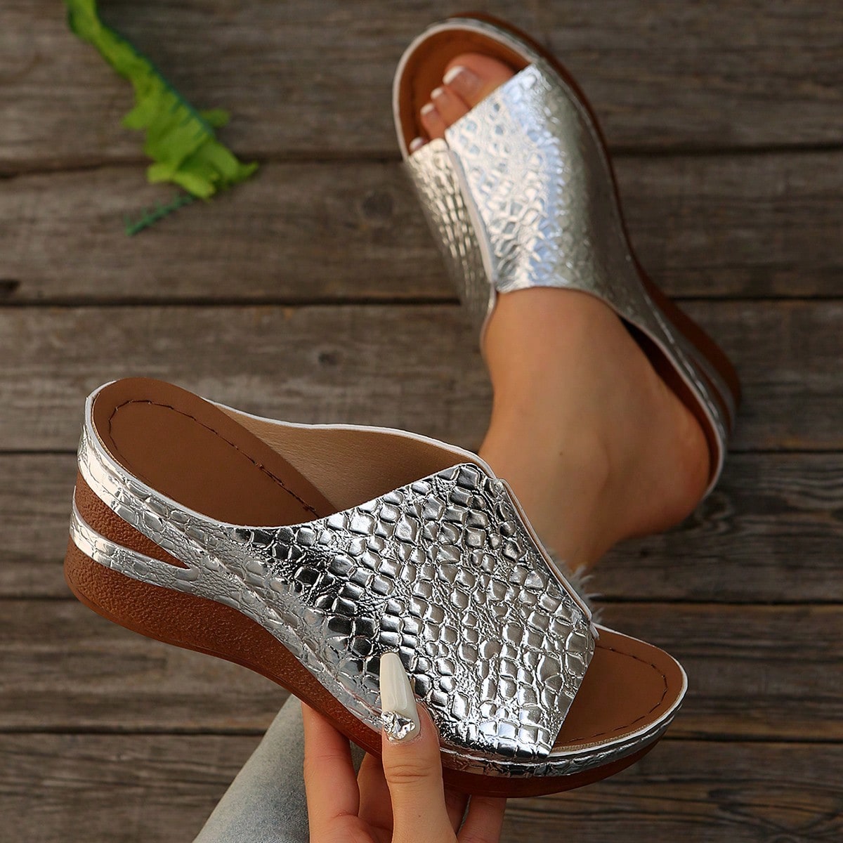 Women’s open-toe wedge slide sandals with hollow-out detail and plain design, one-piece PU leather upper, suitable for outdoor wear.