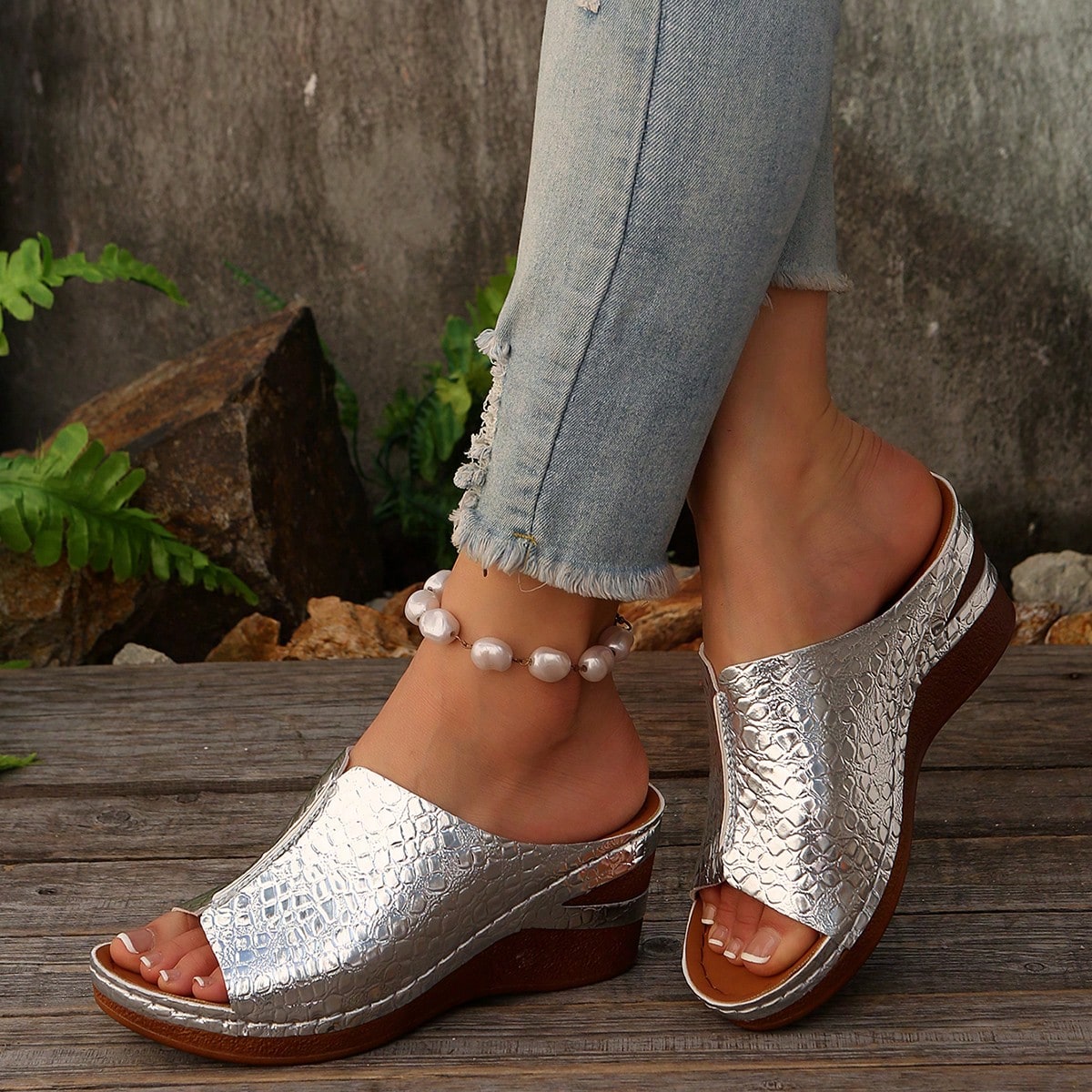 Women’s open-toe wedge slide sandals with hollow-out detail and plain design, one-piece PU leather upper, suitable for outdoor wear.