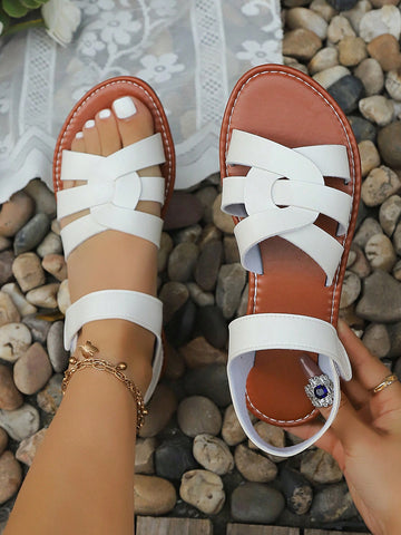 Plus size women's flat sandals with criss-cross straps and open toe, featuring a classic casual style for beach, vacation, commute, and everyday wear.