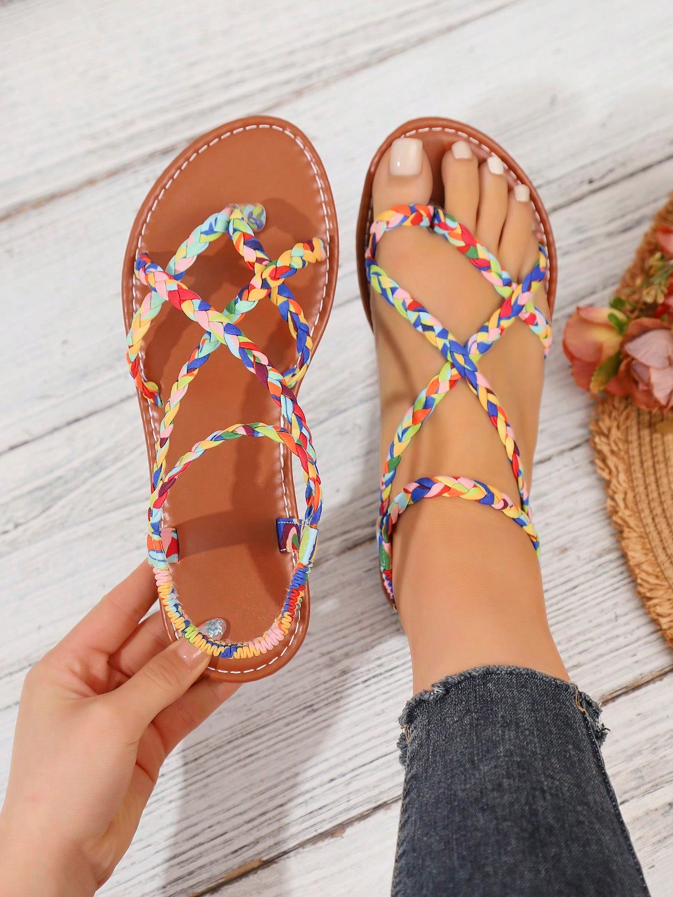 Women's woven criss-cross elastic flat sandals with braided strappy upper and toe post design